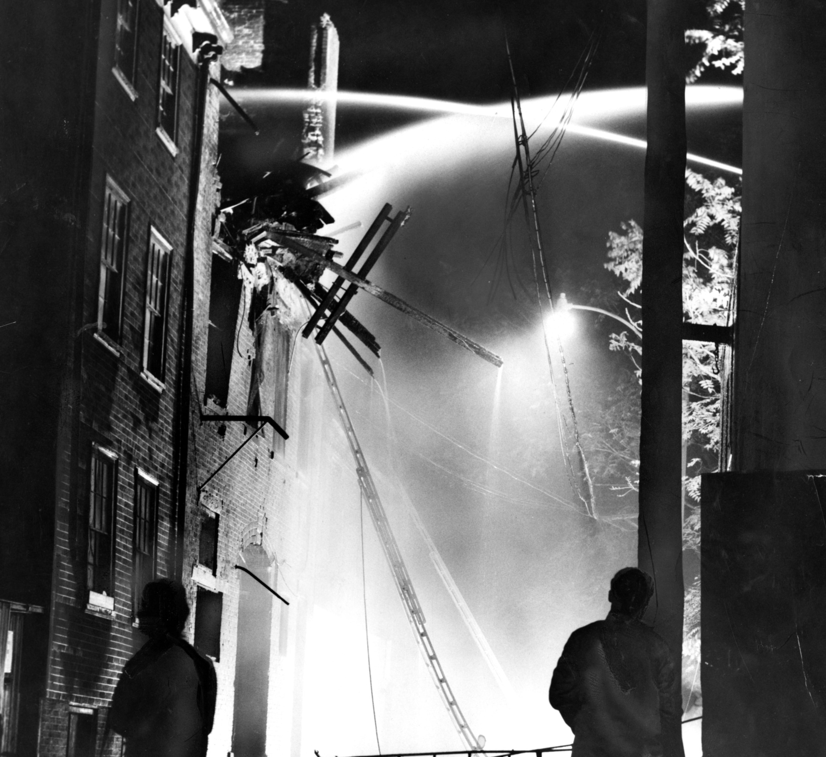 Five firefighters and one civilian were killed when an exterior wall collapsed on them during a fire on the former Trumbull Street in the South End.