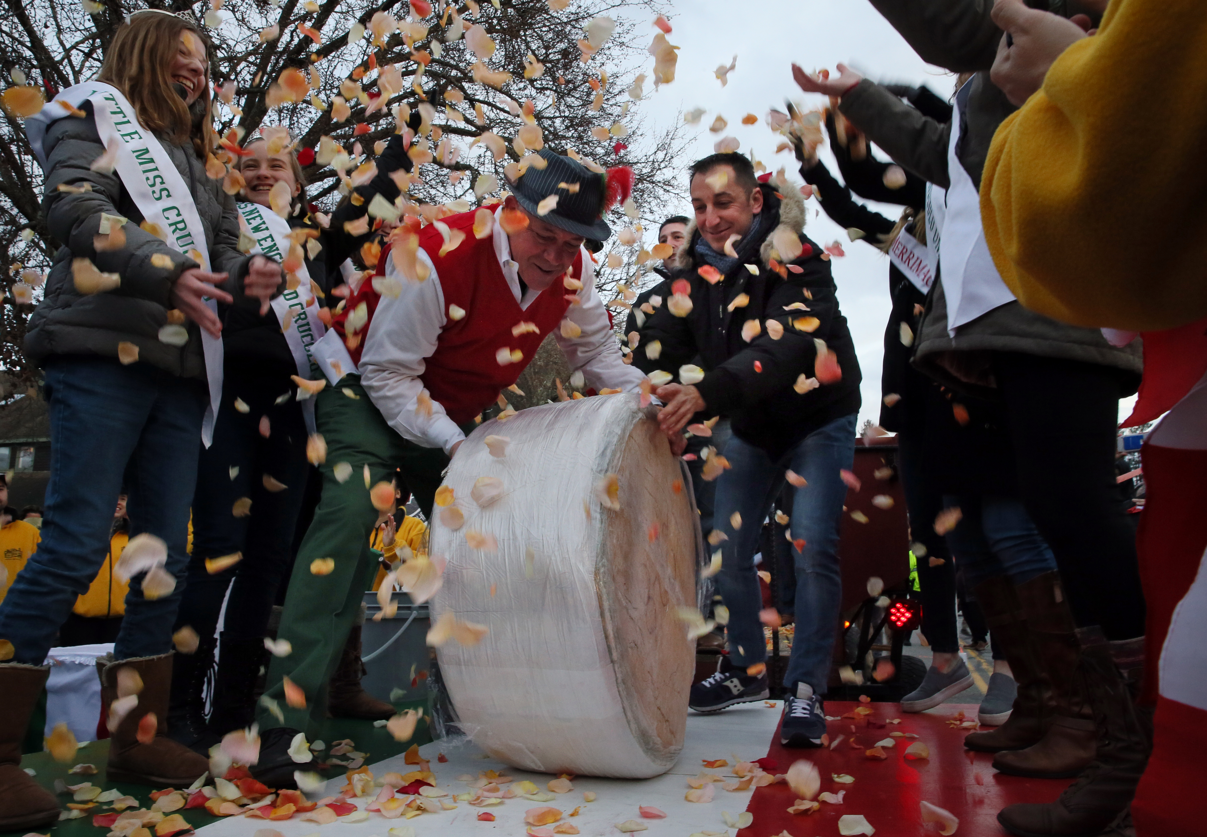 Lovis and cheese maker Devis Enderle of Refugio Di Crucolo rolled the wheel onto the stage.