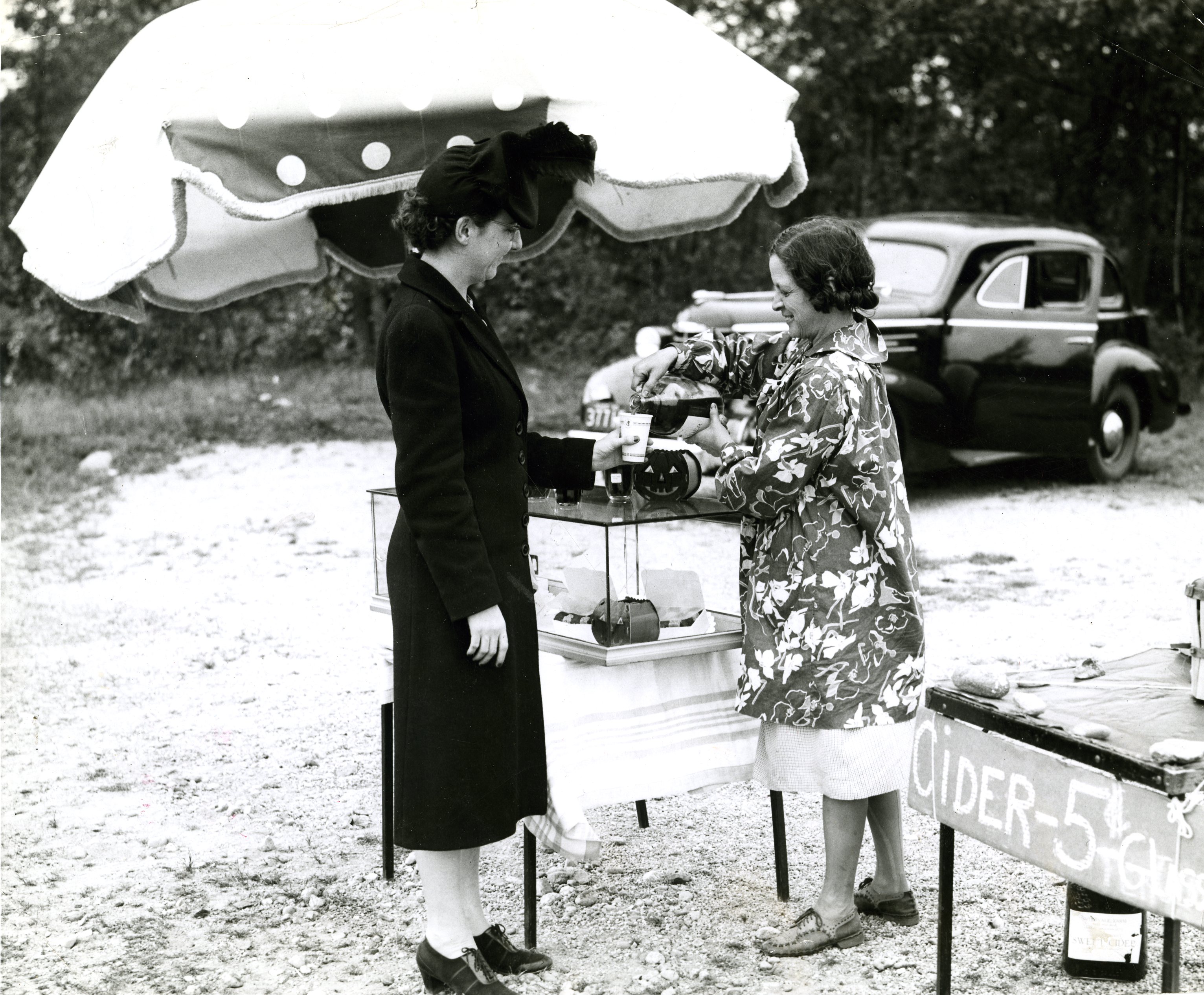 Oct. 20, 1940: Mrs. Edwin Benson of Arlington purchased a glass of homemade cider from Marion Thurston of the Paine-Elm Farm roadside stand in Concord.