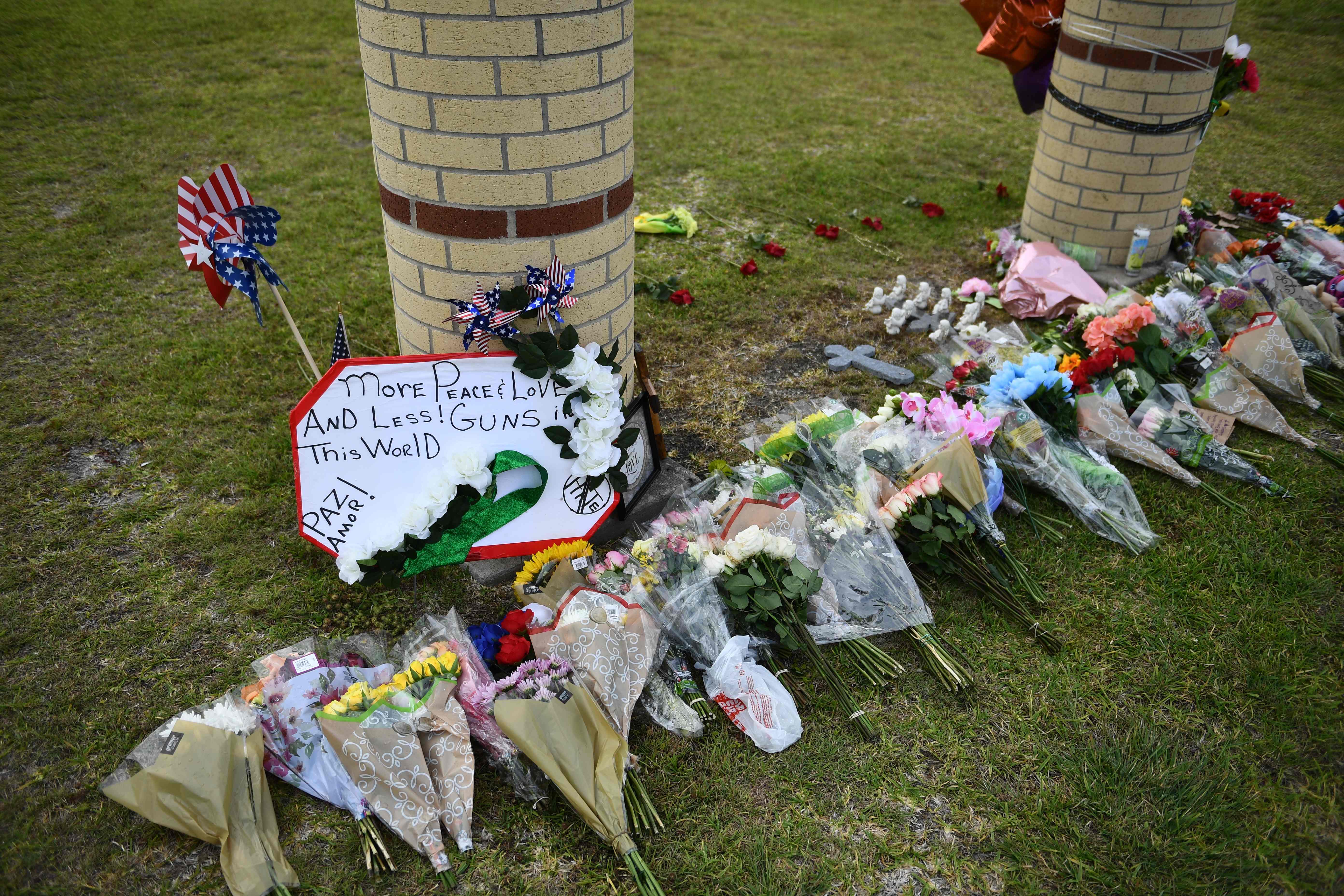 Flowers and memorials were placed on the grounds of Santa Fe High School on Sunday.