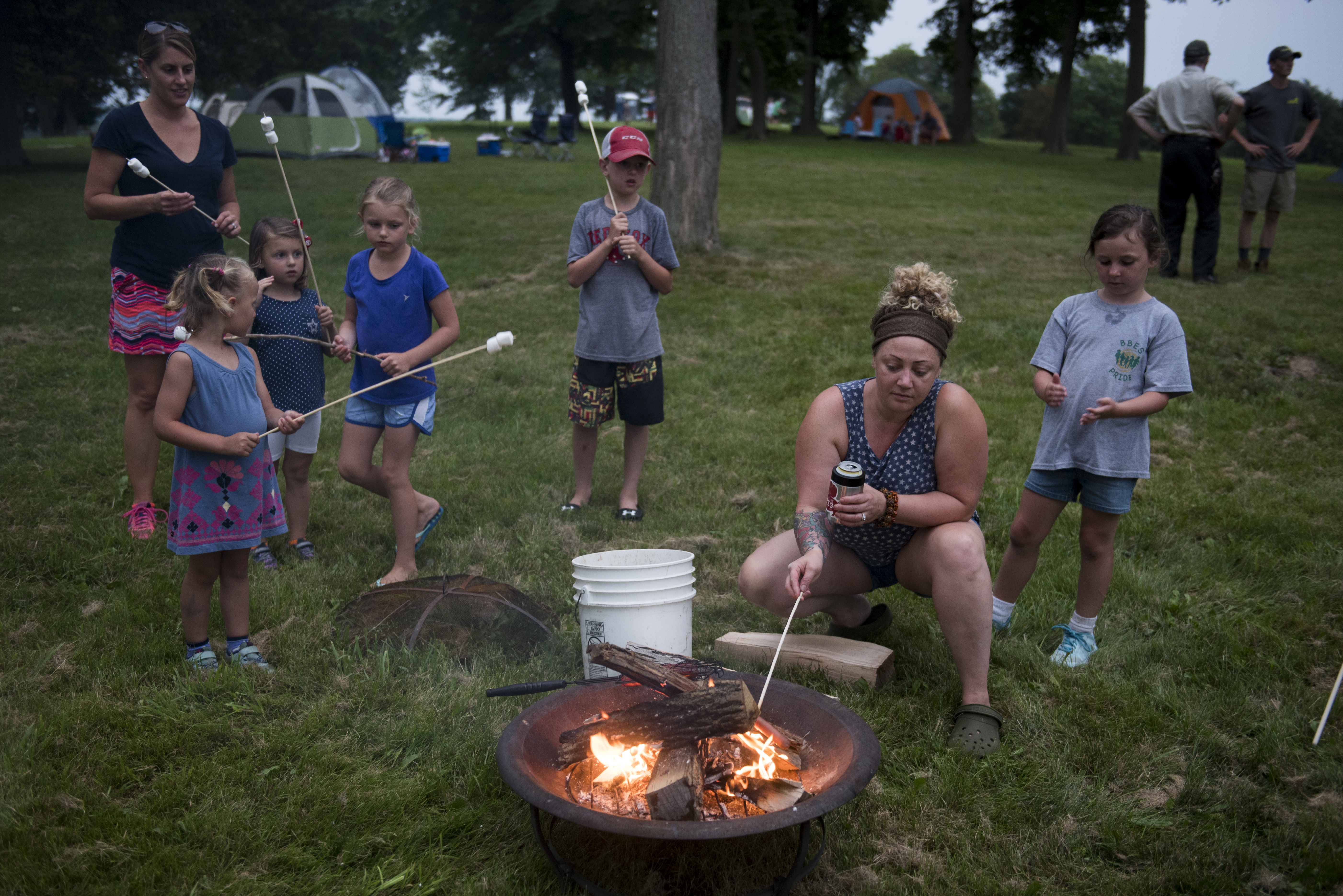 Campers roast marshmallows during the annual World End's Reservation overnight camping event.