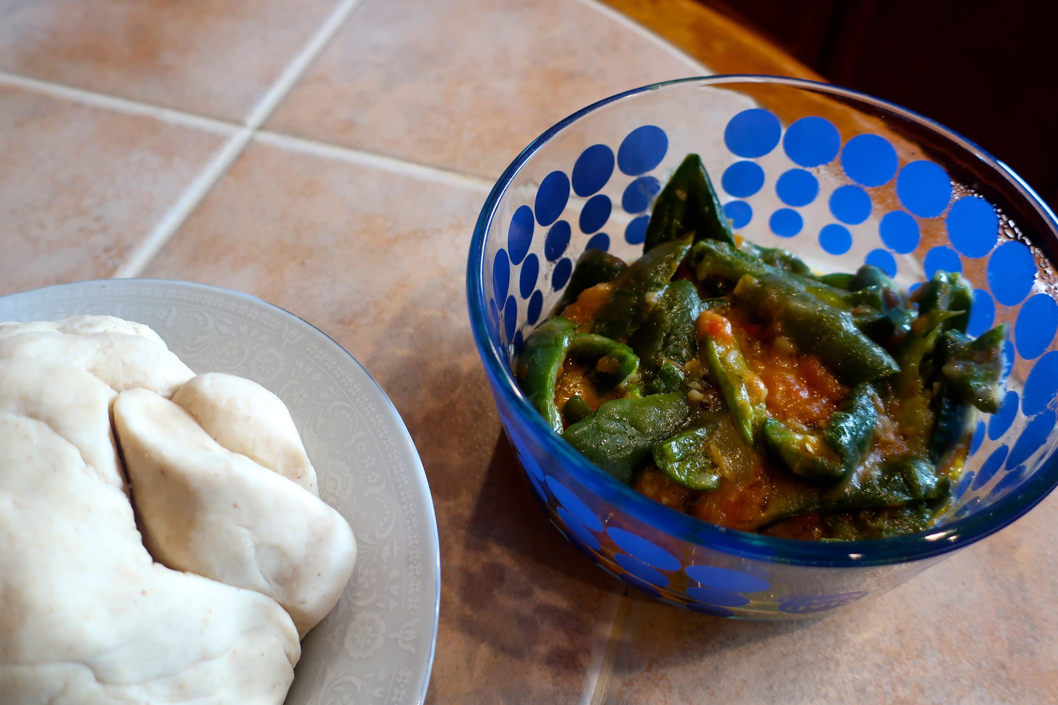 A bowl of dough that will become bhatsa marku (left) and a bowl of ema datshi (right).