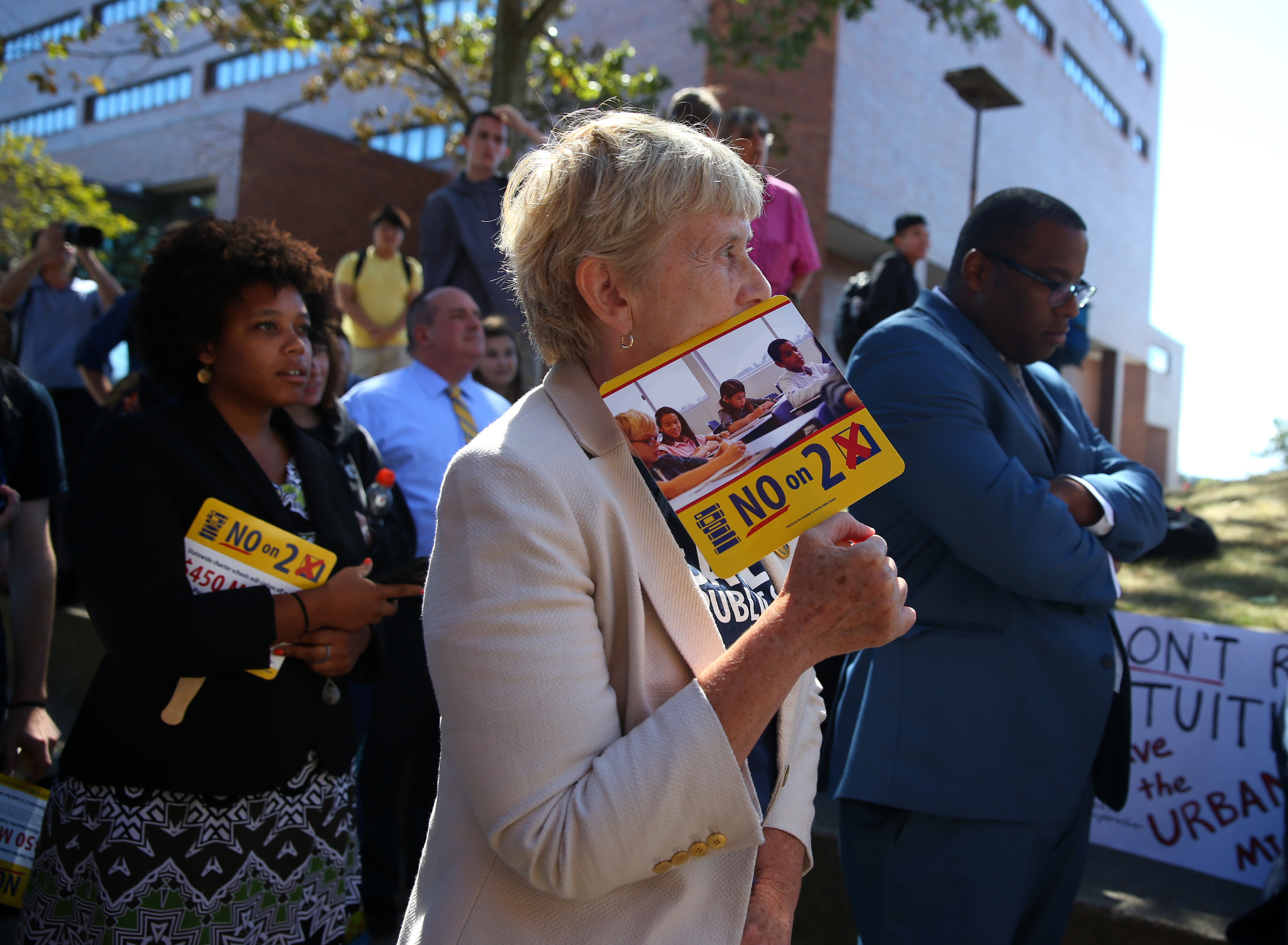 Massachusetts Teachers Association president Barbara Madeloni addressed a rally that also used the event to criticize a state ballot initiative that would lift a state cap on the number of charter schools