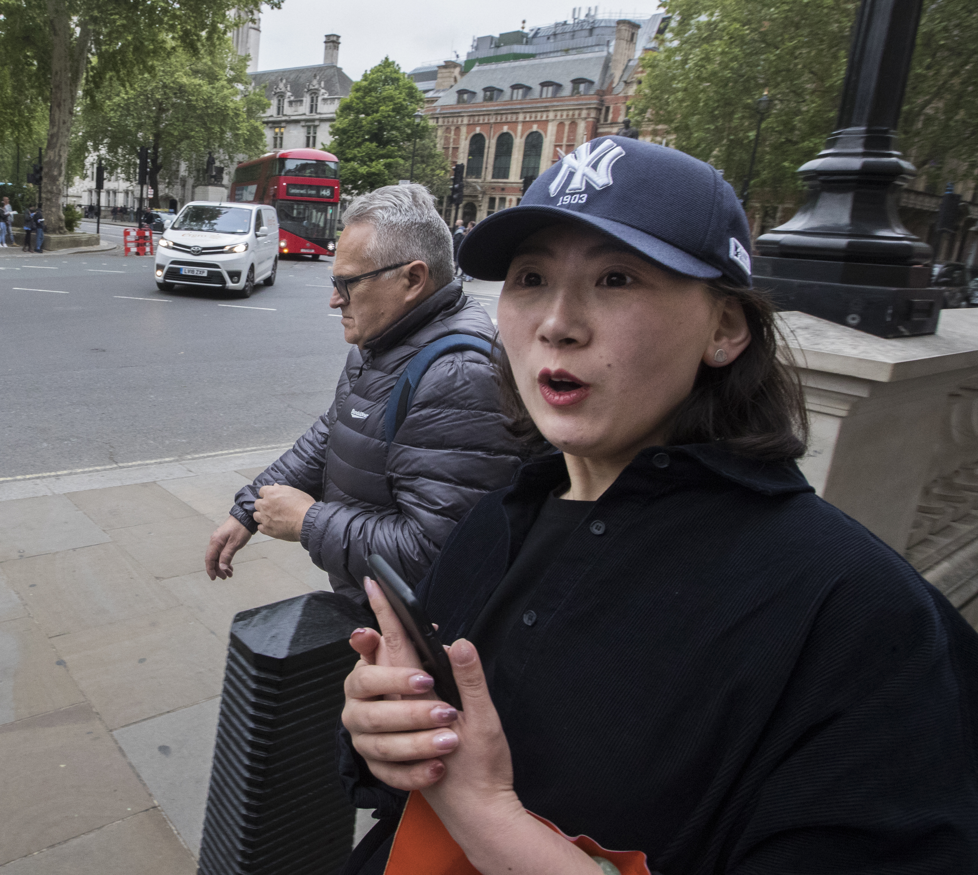 Fiona Yan of Bejing tours London in a Yankees cap, but her loyalty is to fashion, not the team.