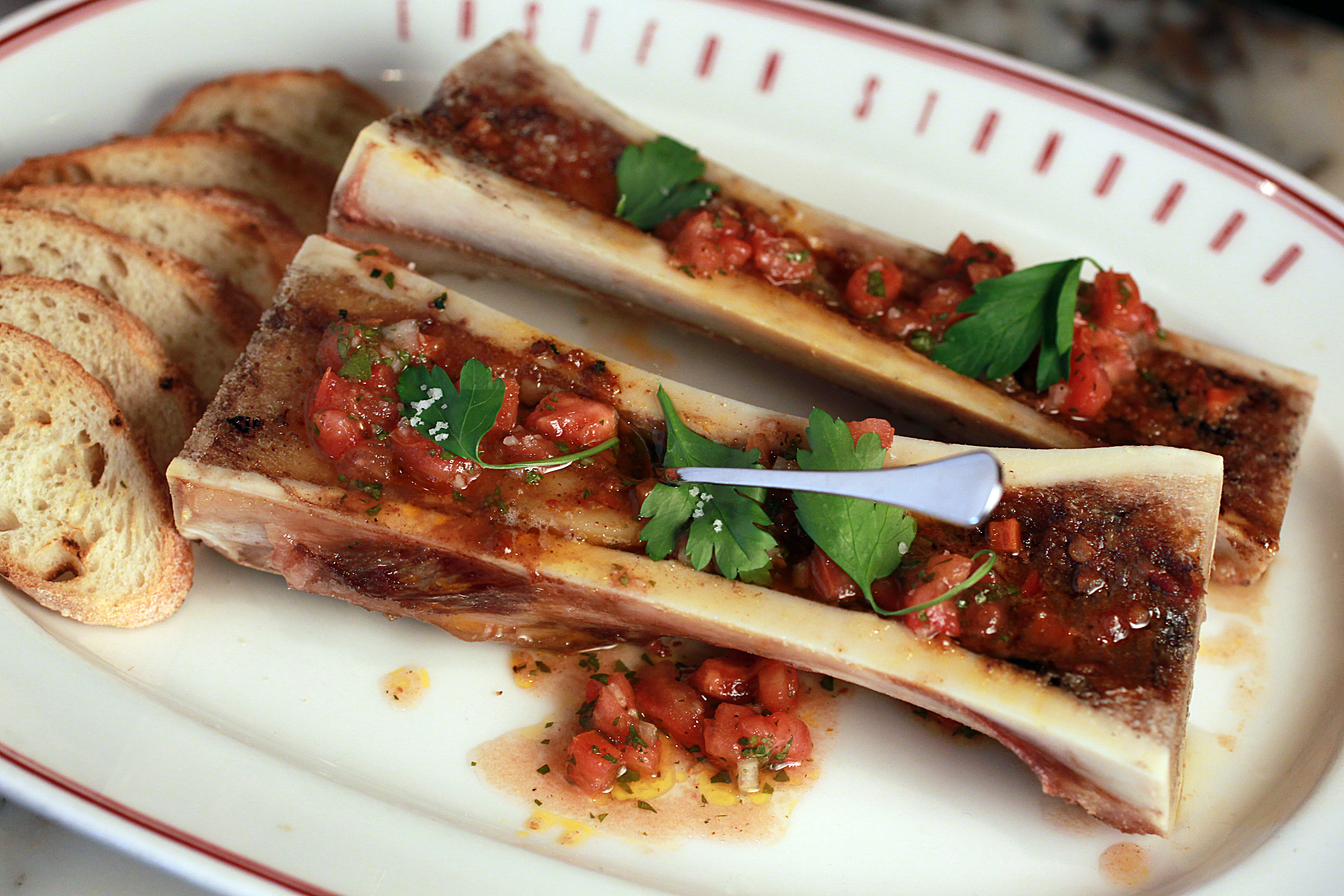 Roasted bone marrow with ’nduja marmalade and tomato vinaigrette.