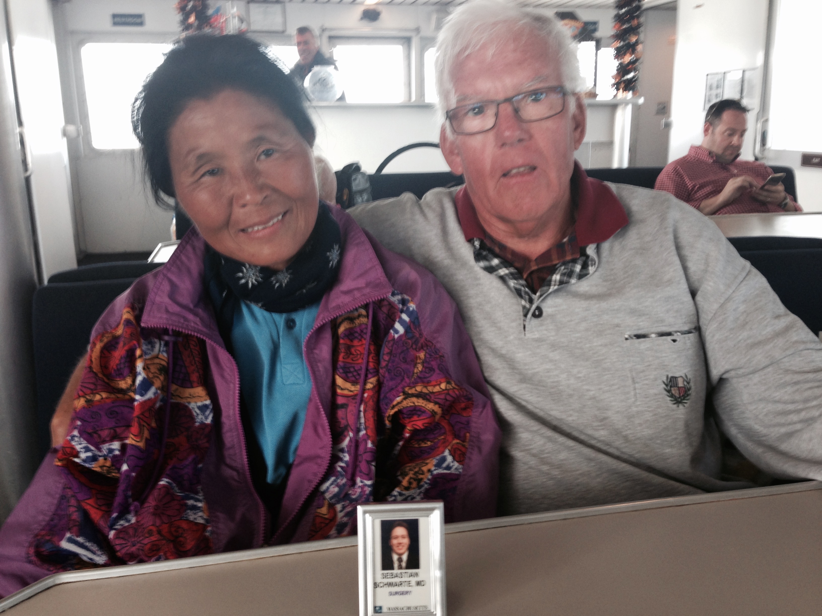 Man-Hee and Karl-Heinz Schwarte with a photo of their son.