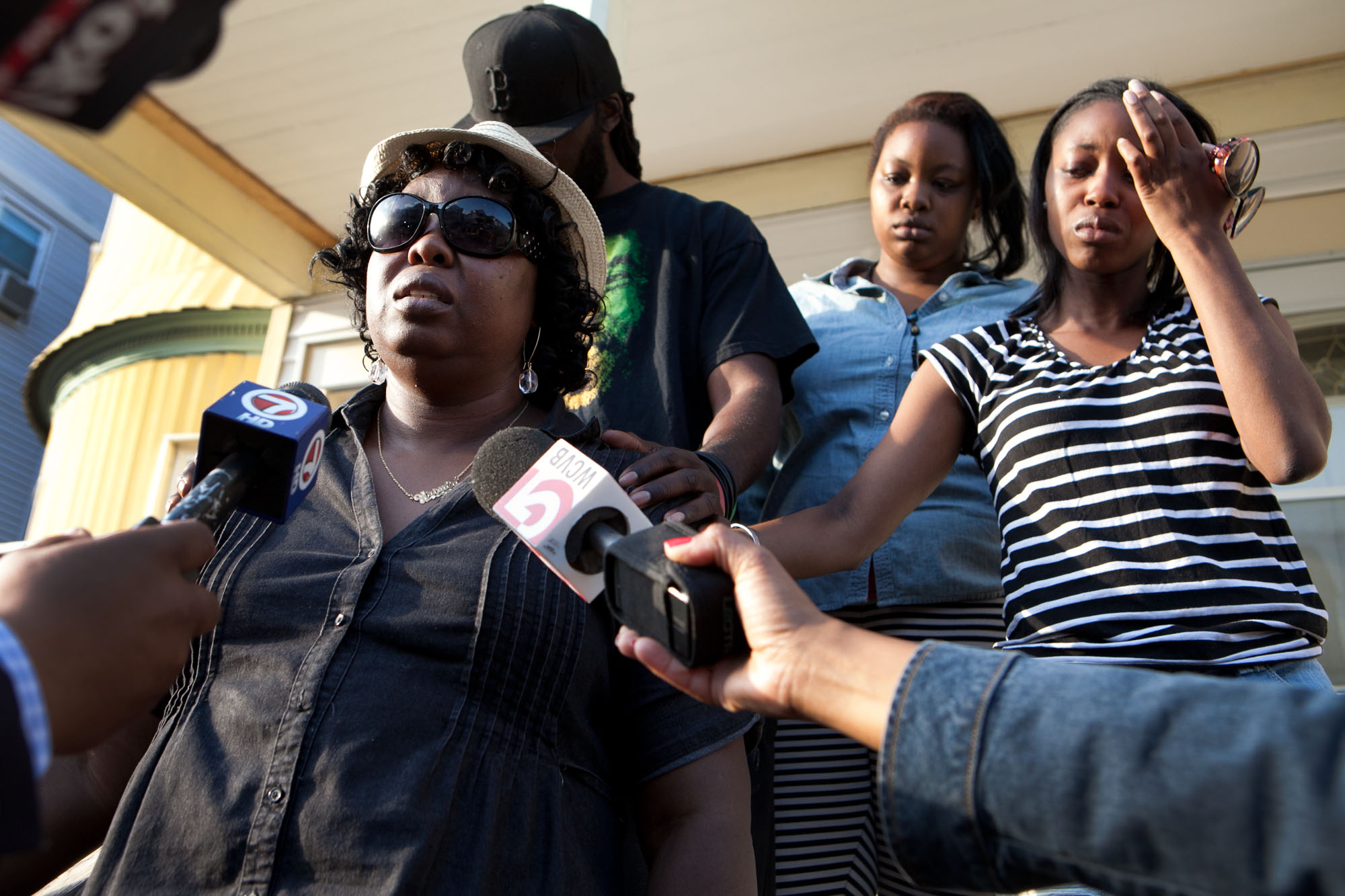 Ursula Ward (far left), mother of Odin Lloyd, gave a statement to the press outside of her home in Dorchester.