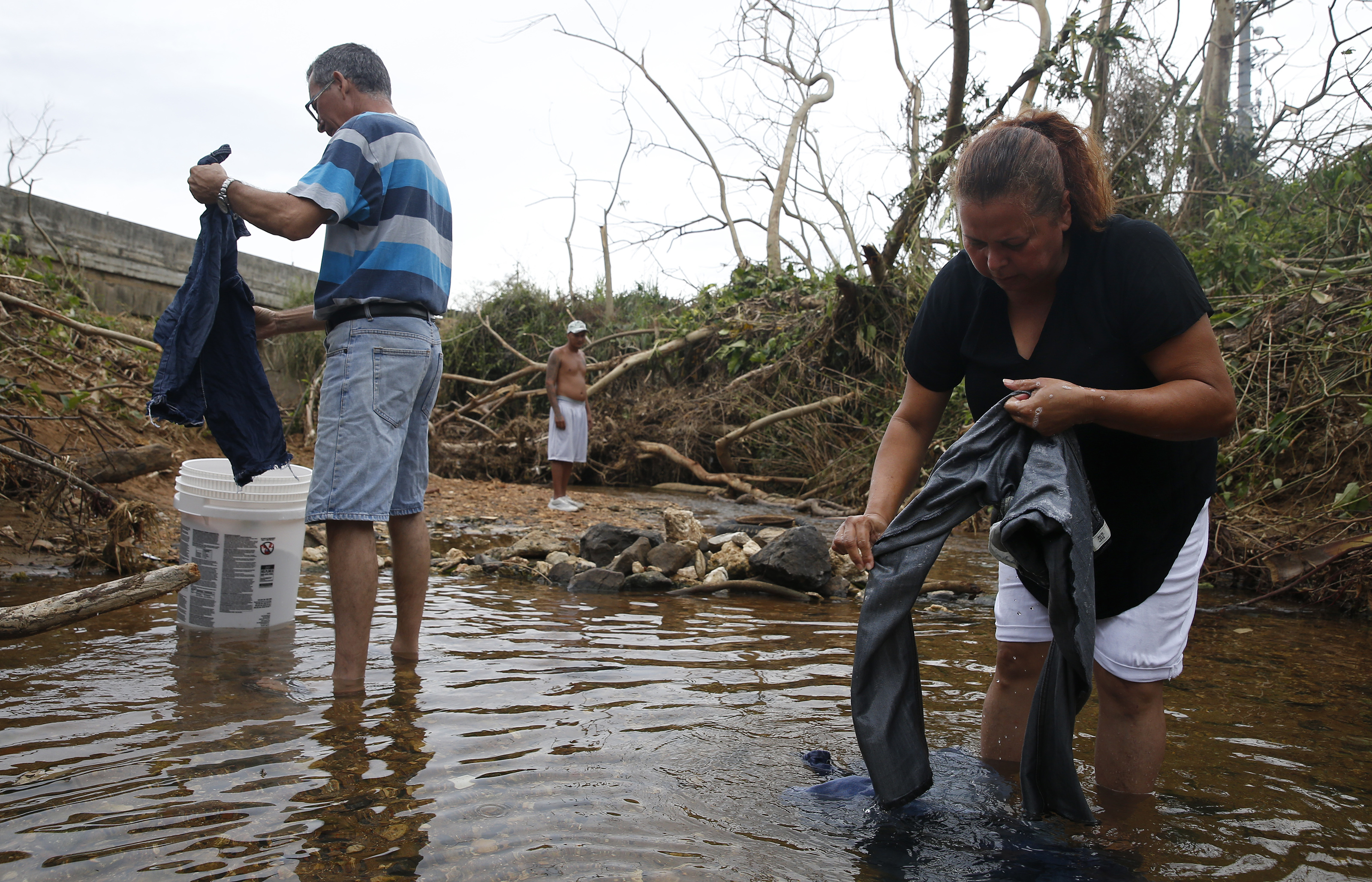 Elizabeth Nieves and Carlos Hernandez washed clothes in a river.