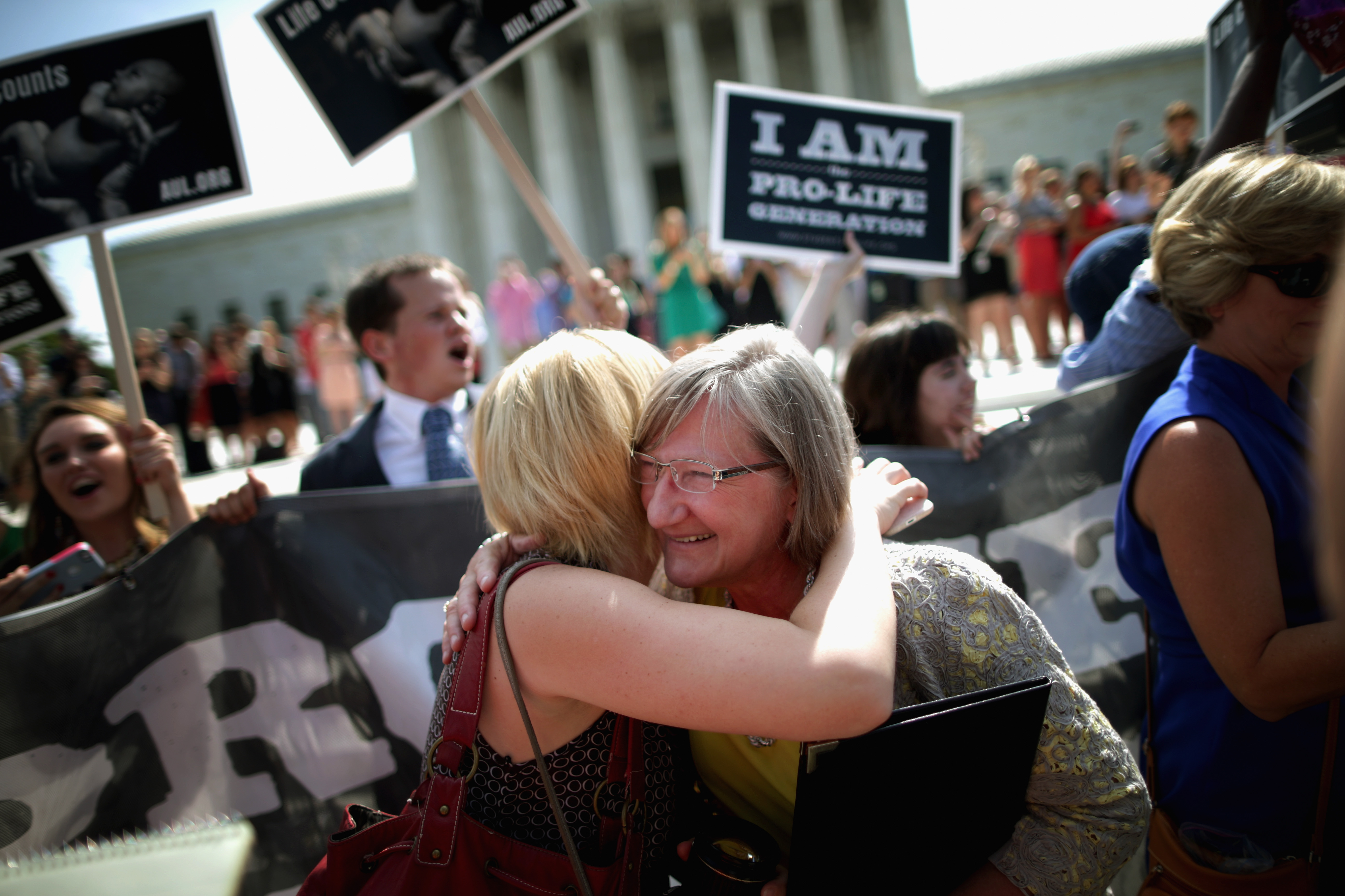 Anti-abortion advocates cheered in front of the Supreme Court after the decision in the Hobby Lobby Stores case was announced.