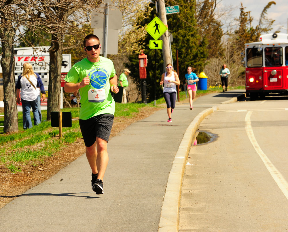 Stop the Stigma 5K participant Bill Ainslie of Norwell approaches the finish line at last year's race.