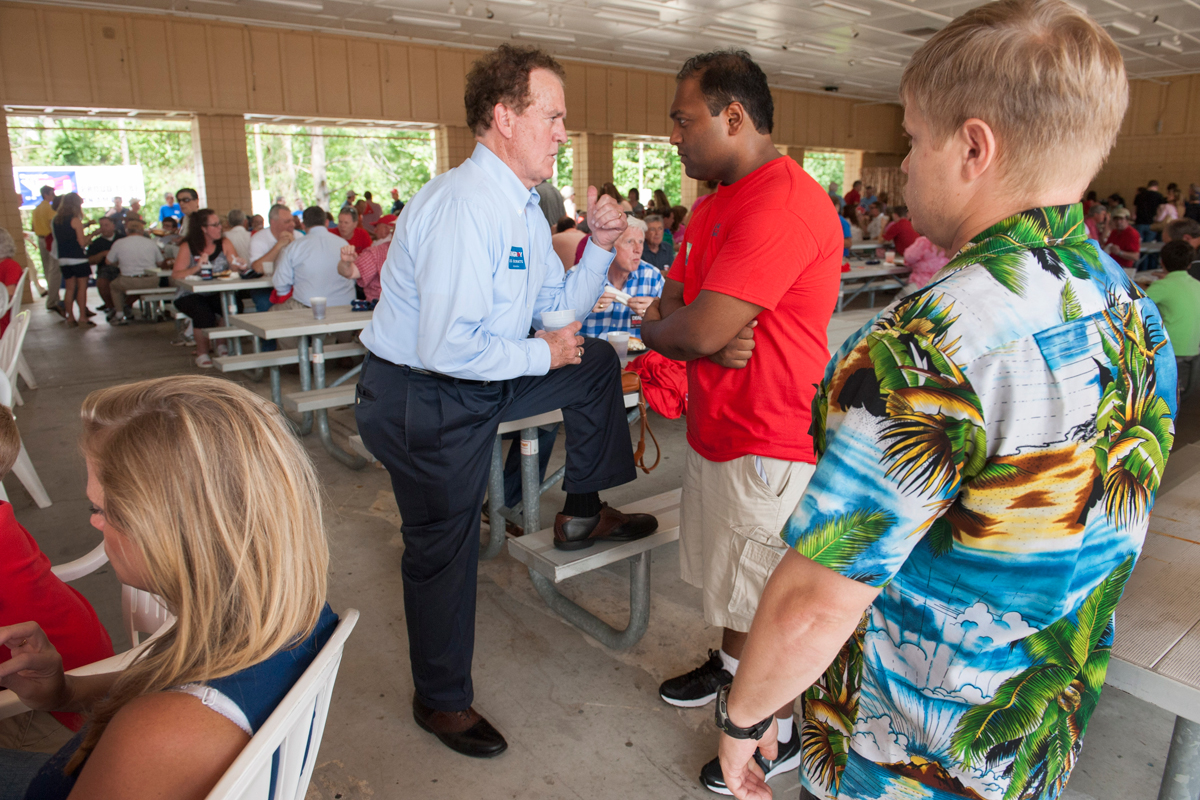 Representative Phil Gingrey (left), a candidate for the Senate, talked with a voter at a Republican event in Georgia.