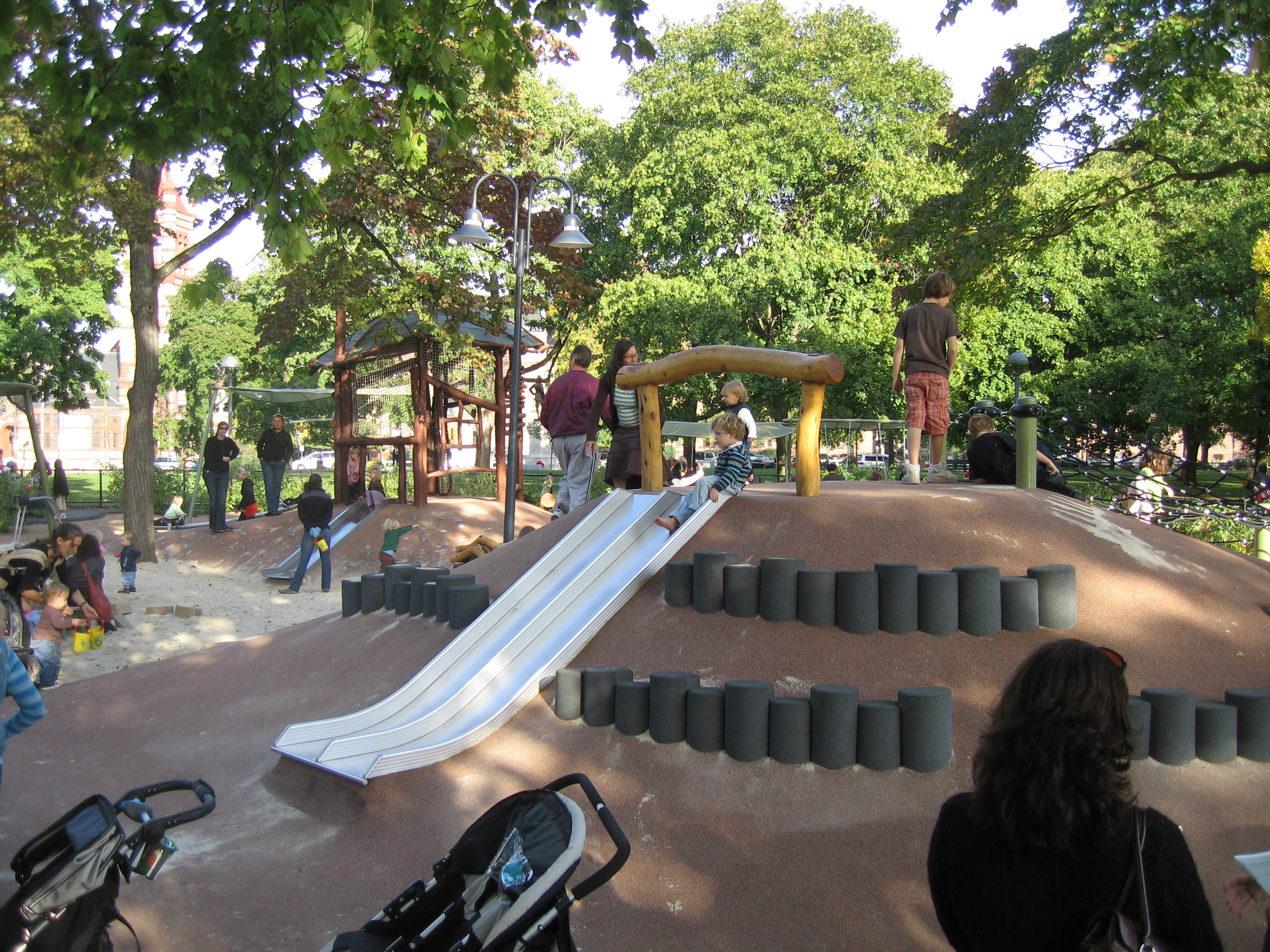 Some child development experts now advocate for playgrounds incorporating “loose parts,” like those at the Alexander W. Kemp Playground at Cambridge Common.