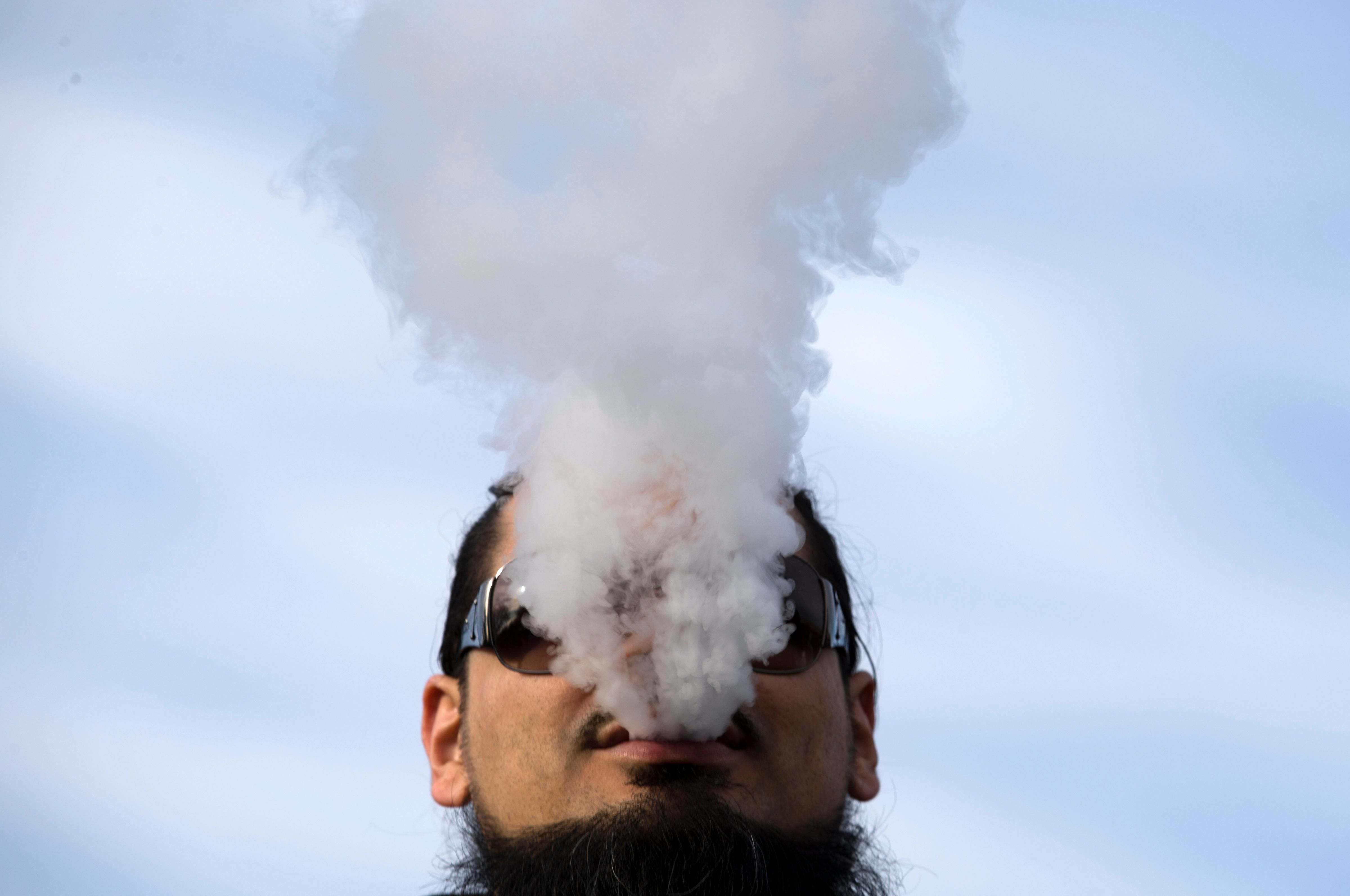 A demonstrator vaped in front of the White House to protest the vaping flavor ban.