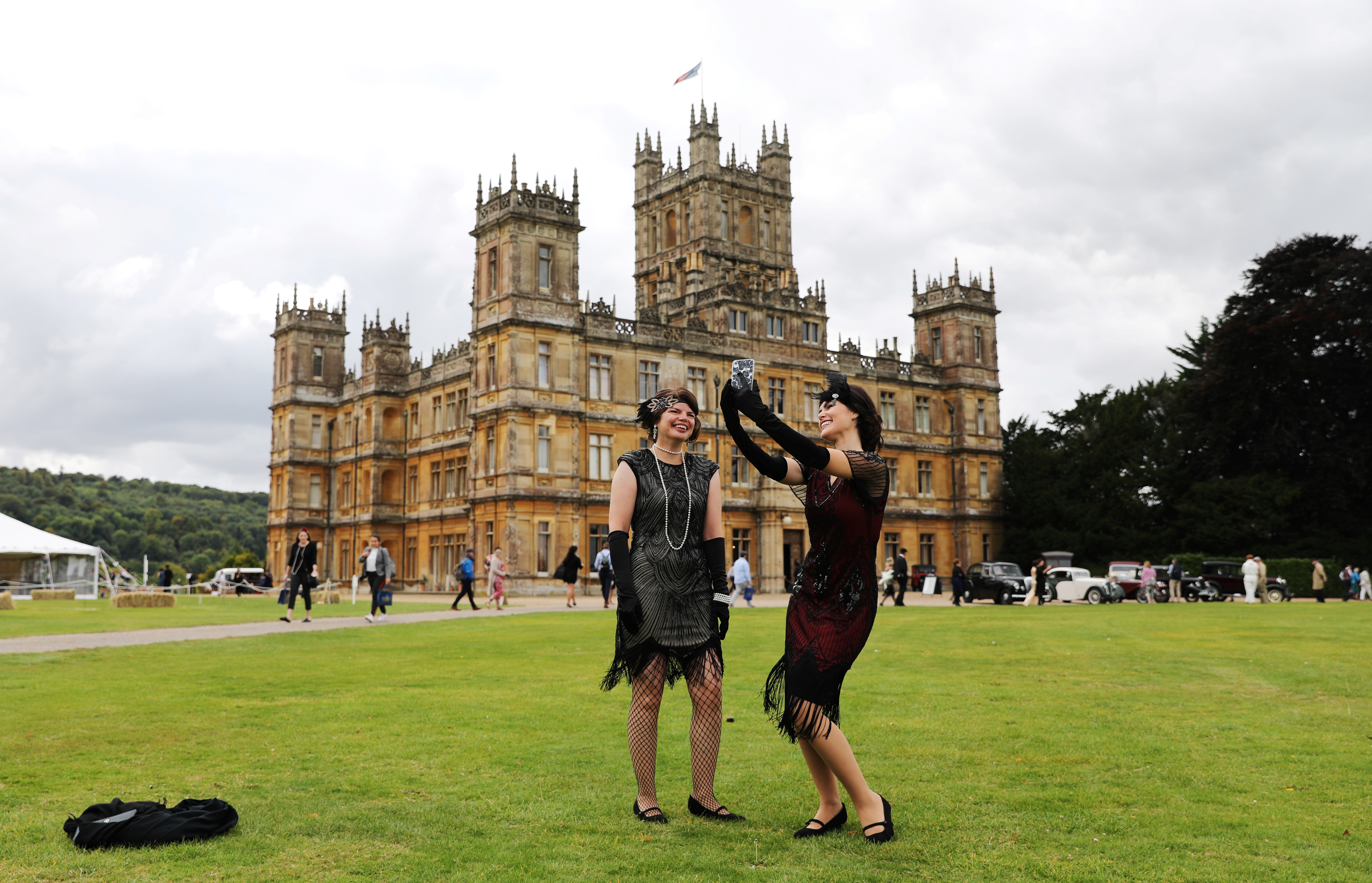 Visitors attend a 1920s-themed event at Highclere Castle, near Newbury, west of London, last September, ahead of the world premiere of the "Downton Abbey" film.