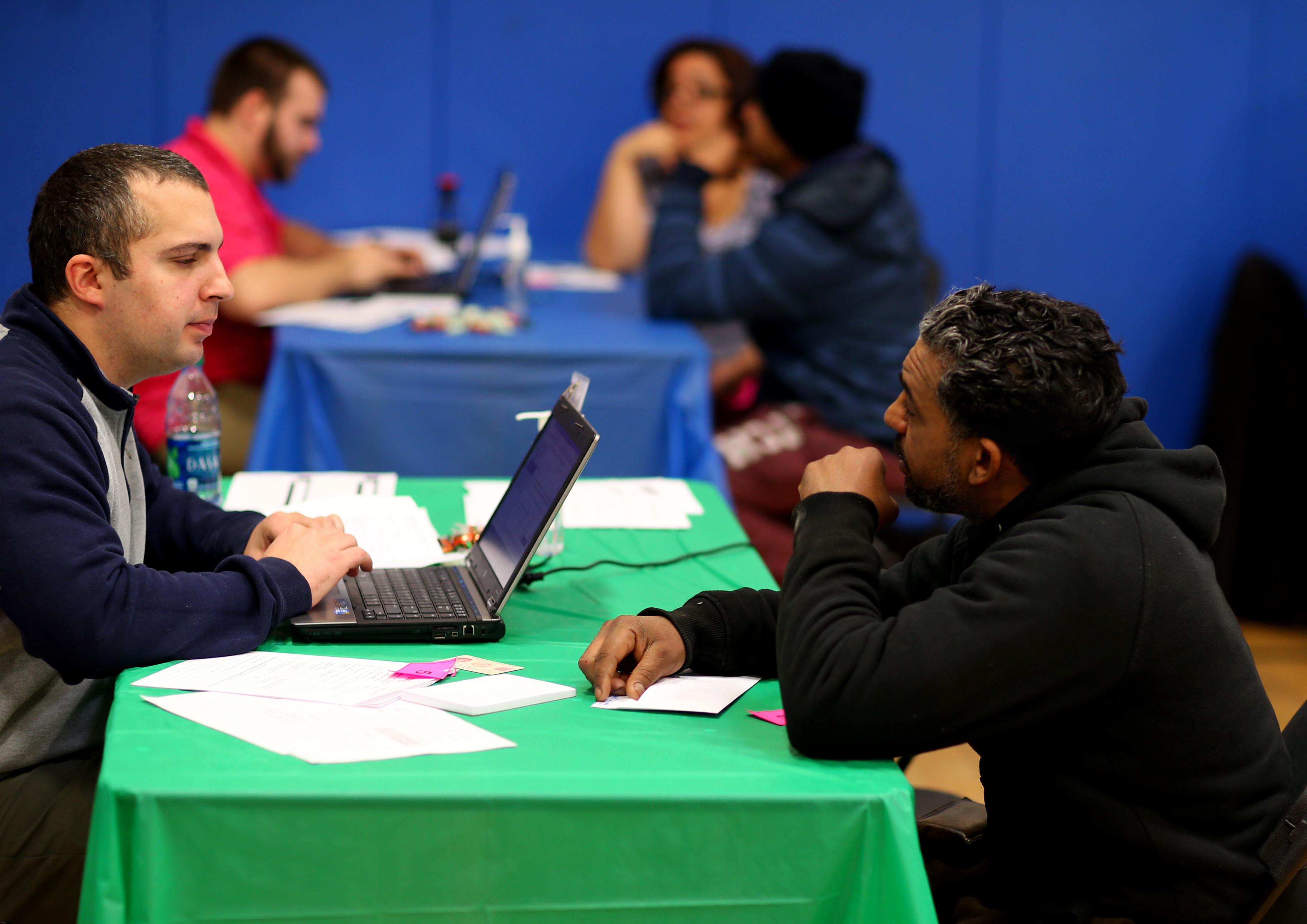 Patrick Gobbi (left) worked with Wilson Santana to get him signed onto the state health plan.