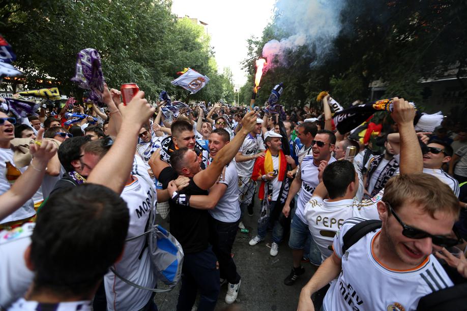 Real Madrid fans drank, danced and cheered on Calle de Marceliano Santa Maria near the Bernabeu Stadium in anticipation of their teamÕs EUFA Championship.