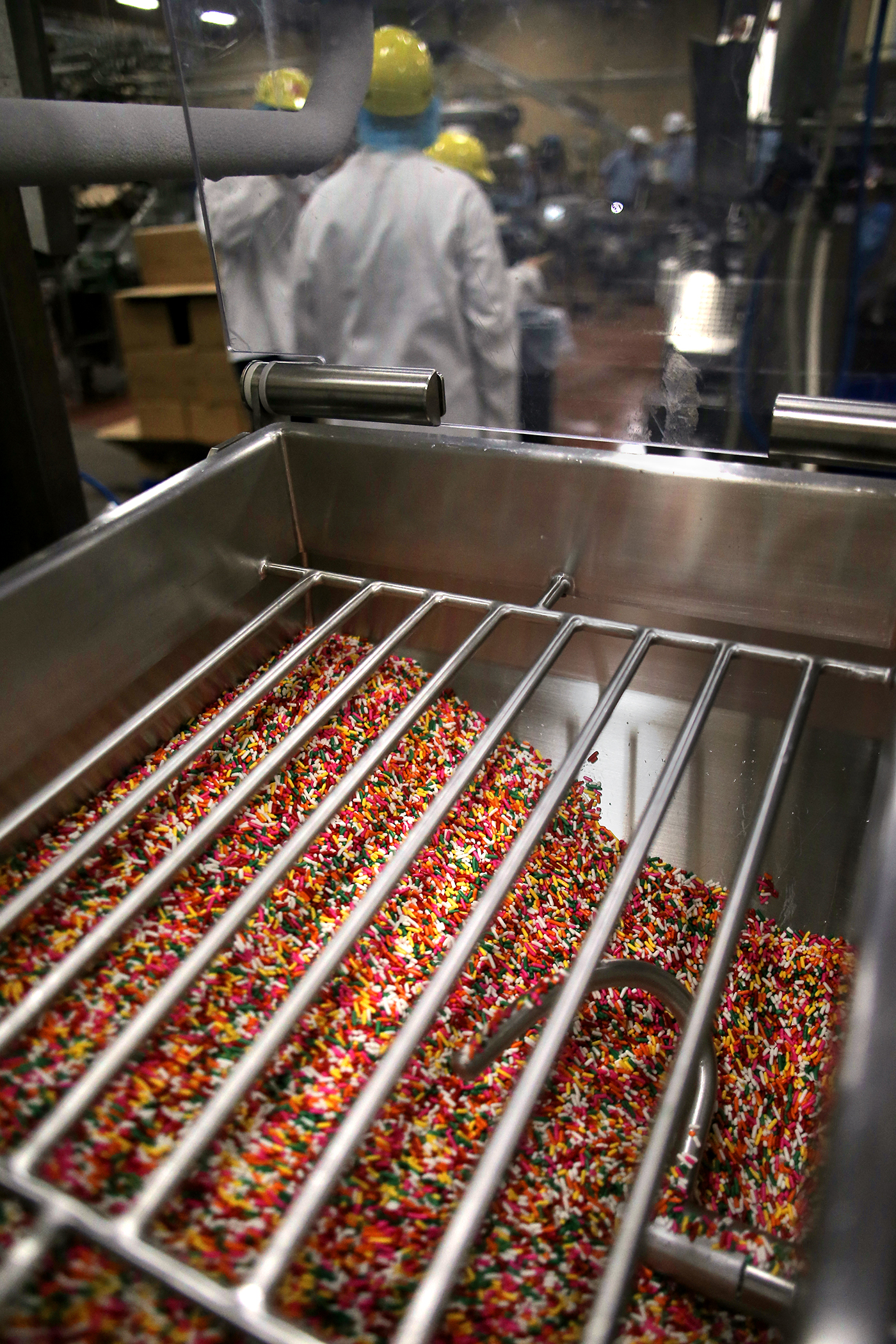 A hopper full of sprinkles fed into a line producing ice cream sandwiches at the HP Hood Ice Cream Plant in Suffield, Conn.