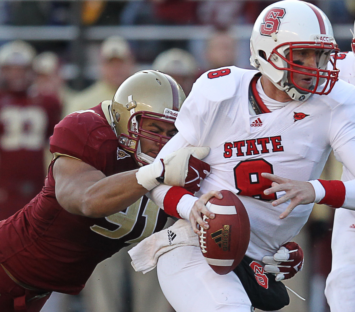 BC defensive end Kasim Edebali drags down N.C. State quarterback Mike Glennon for a fourth-quarter tackle.