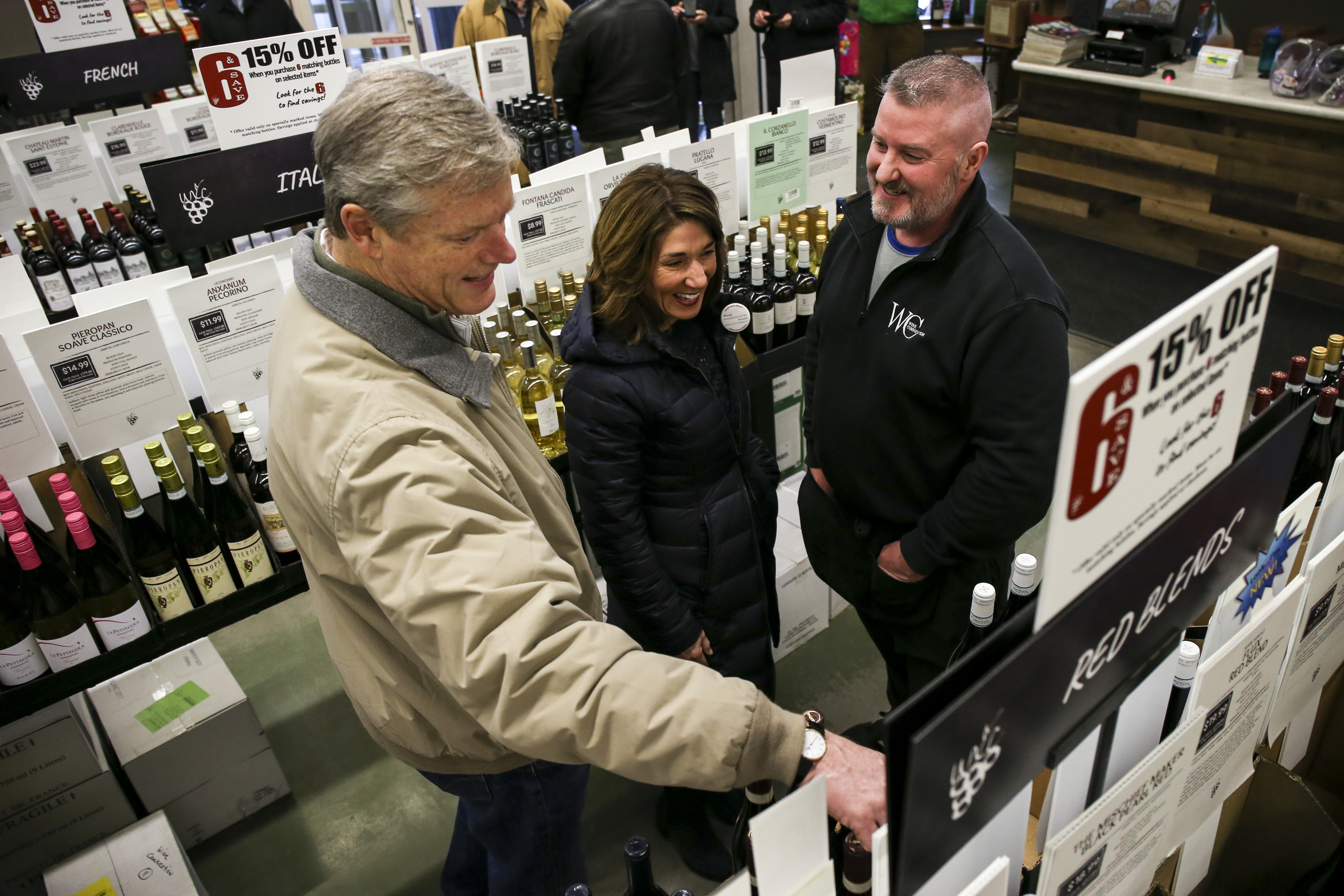 Baker (left) and Lieutenant Govenror Karyn Polito (center) browsed wine at the Wine ConneXtion in North Andover.