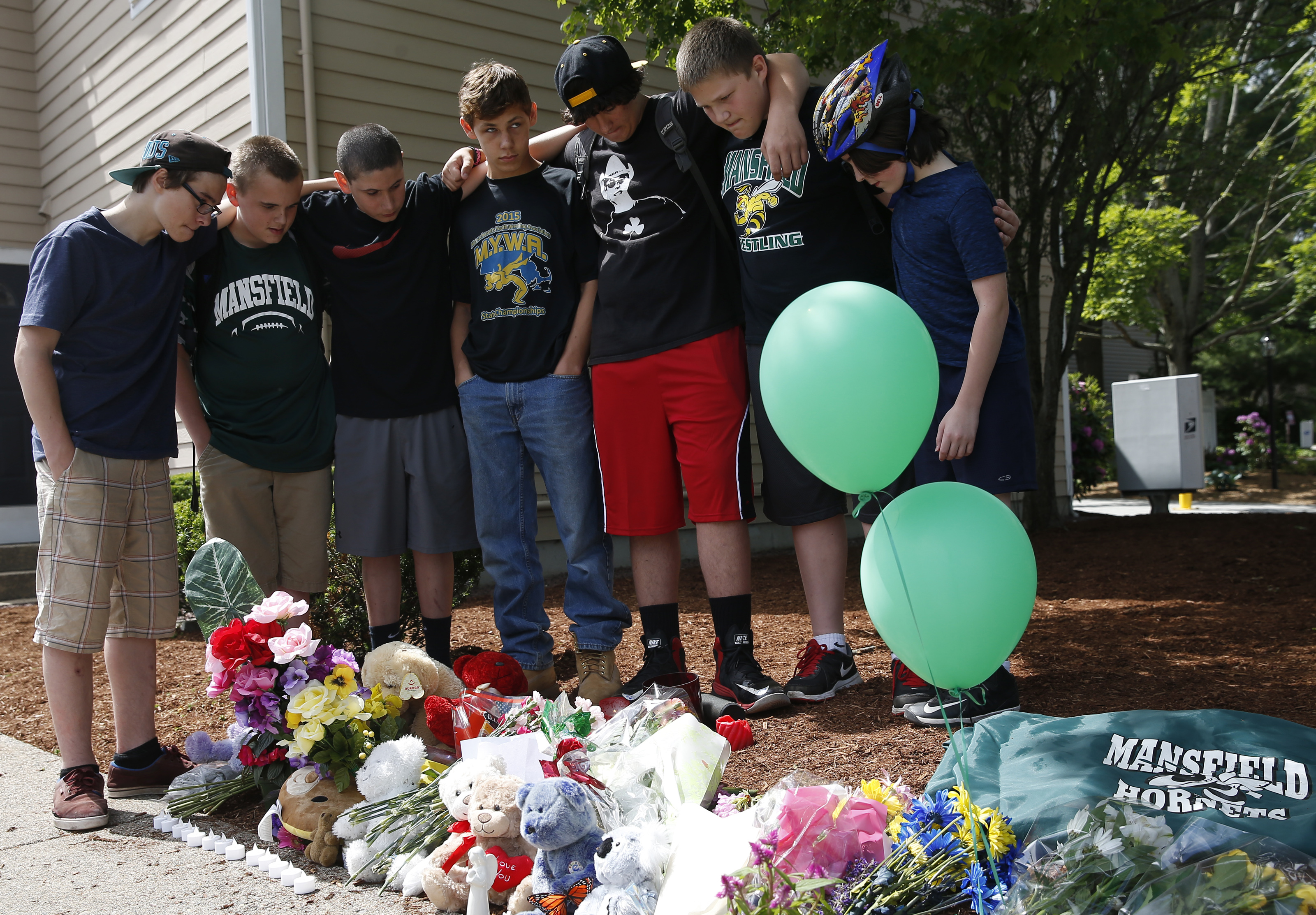 Shane’s friends gathered around his memorial and listened to a song on Thursday.
