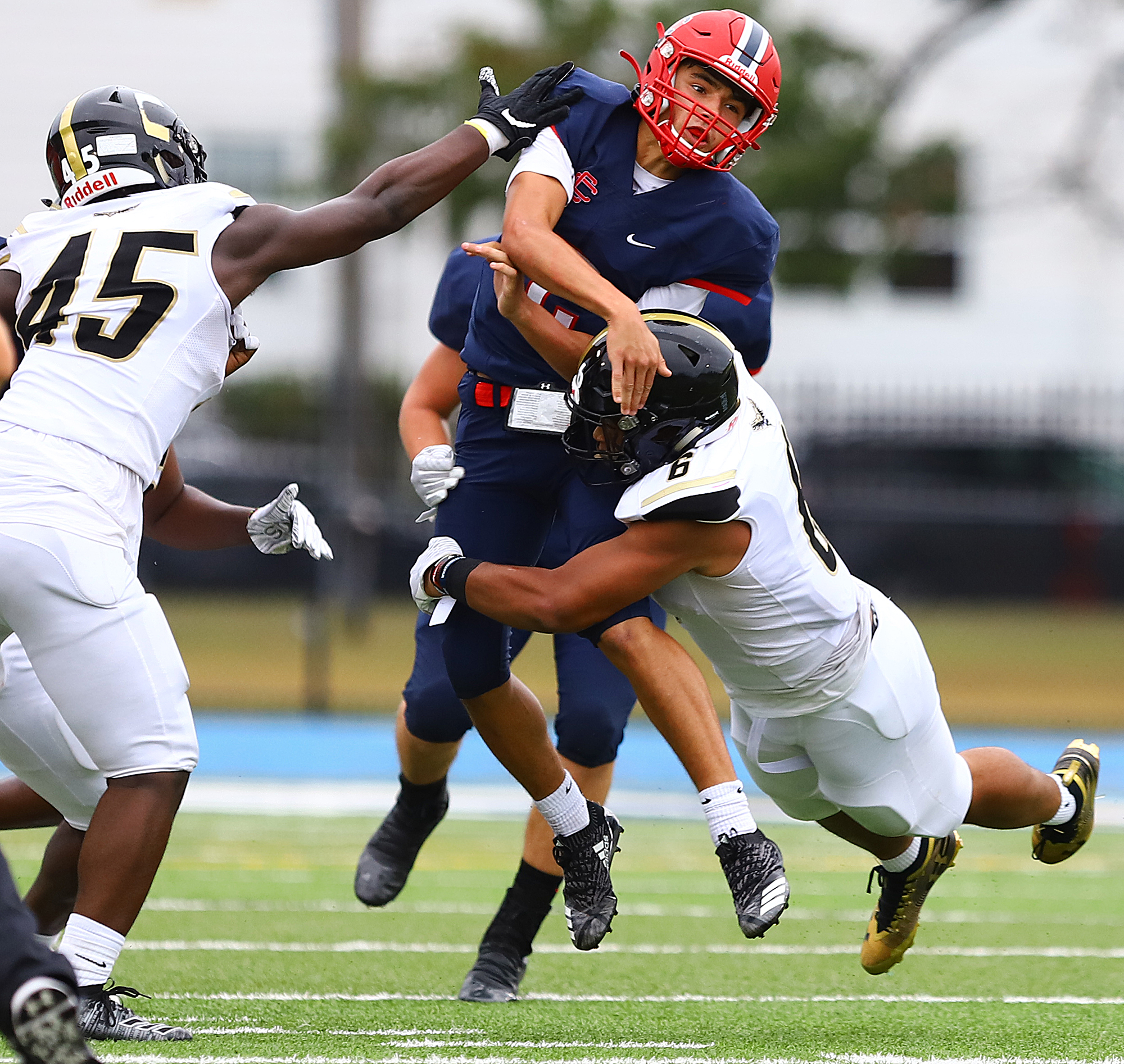 Central Catholic's sophomore quarterback Ayden Pereira stood tall in the pocket amid heavy pressure in his varsity debut for the Red Raiders in a 52-42 victory over Springfield Central.