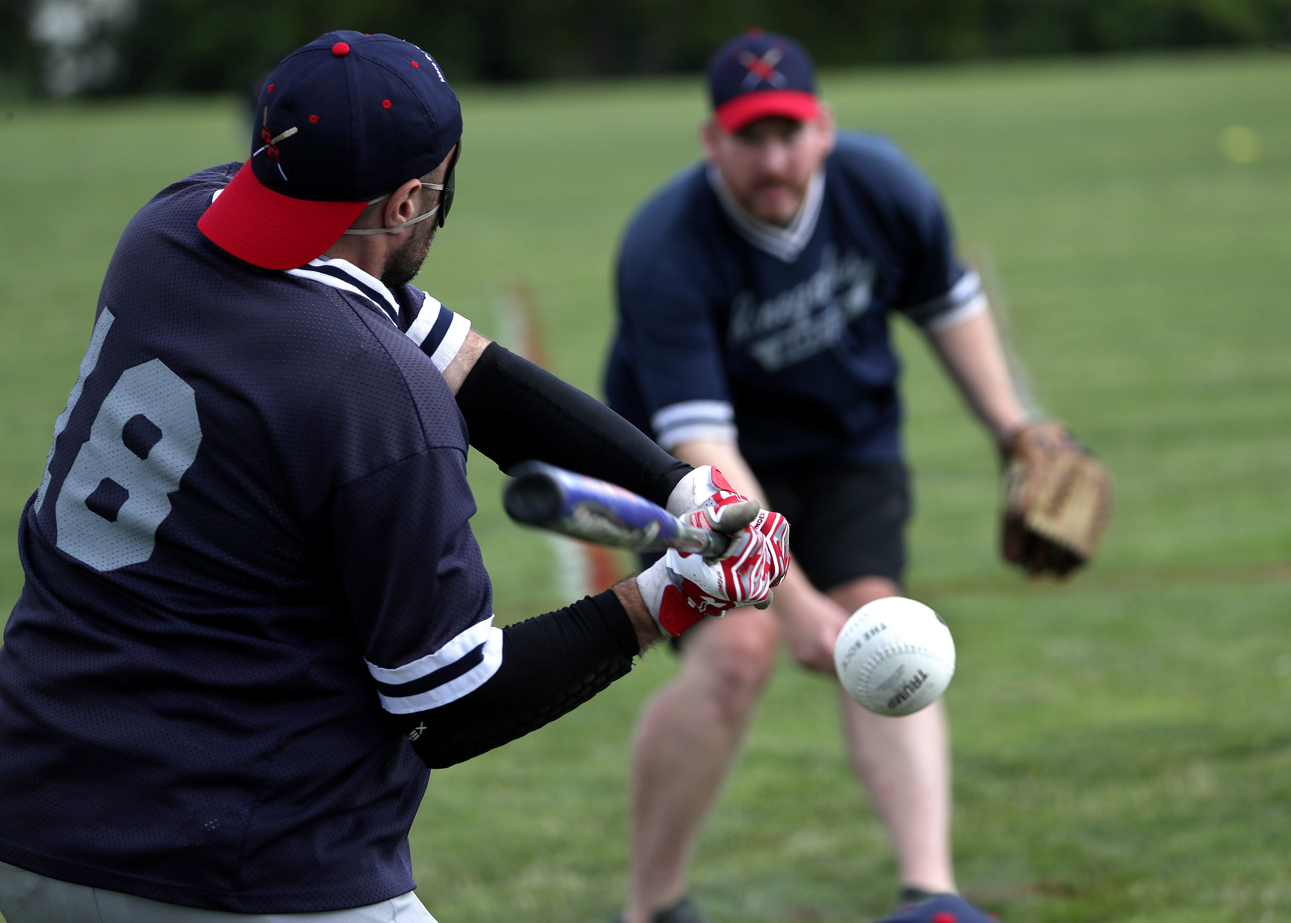 Renegades pitcher Ron Cochran delivers to teammate Rob Dias during the Beast of the East Tournament.
