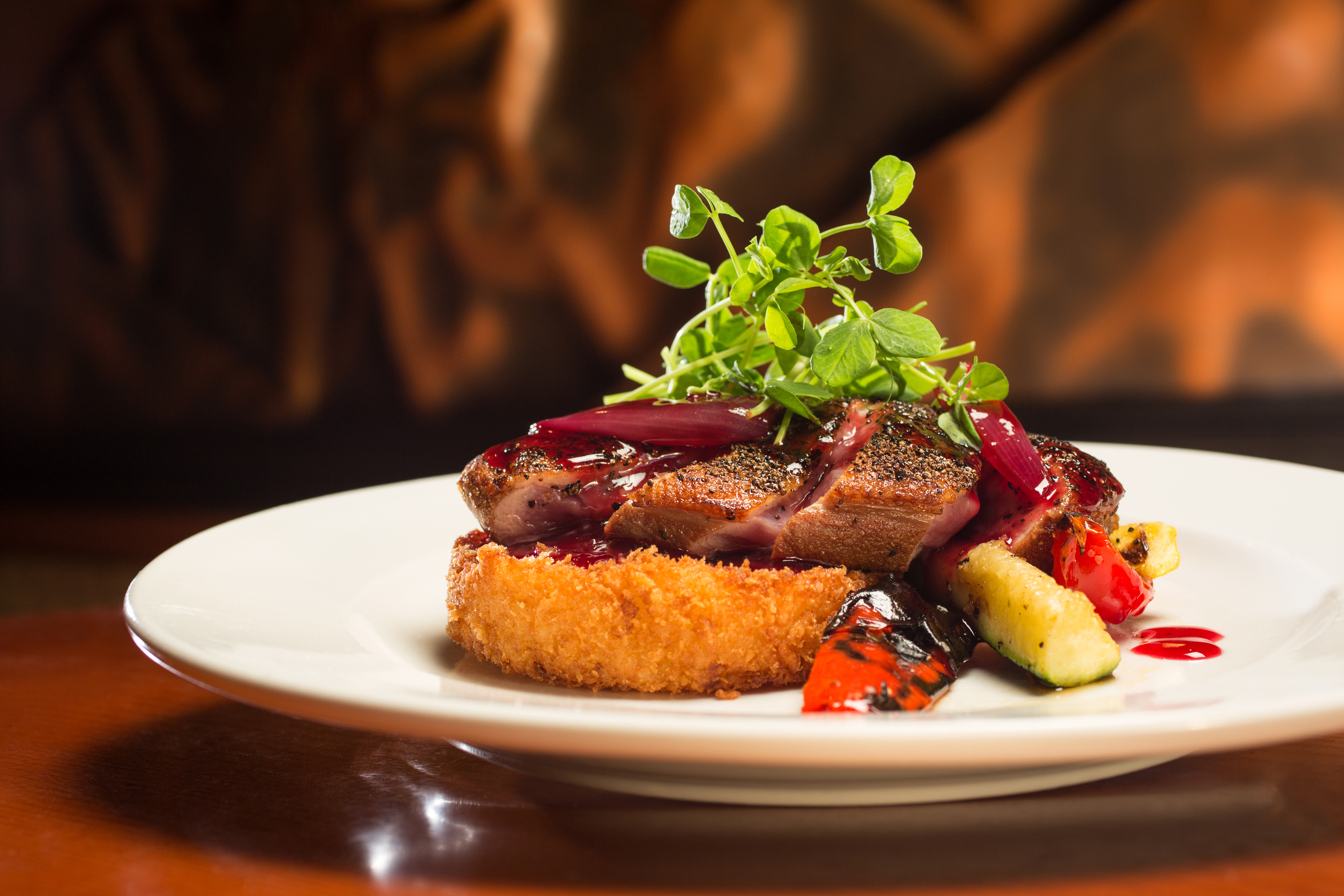 Pan-seared duck breast with risotto cake at Wild River Grille.