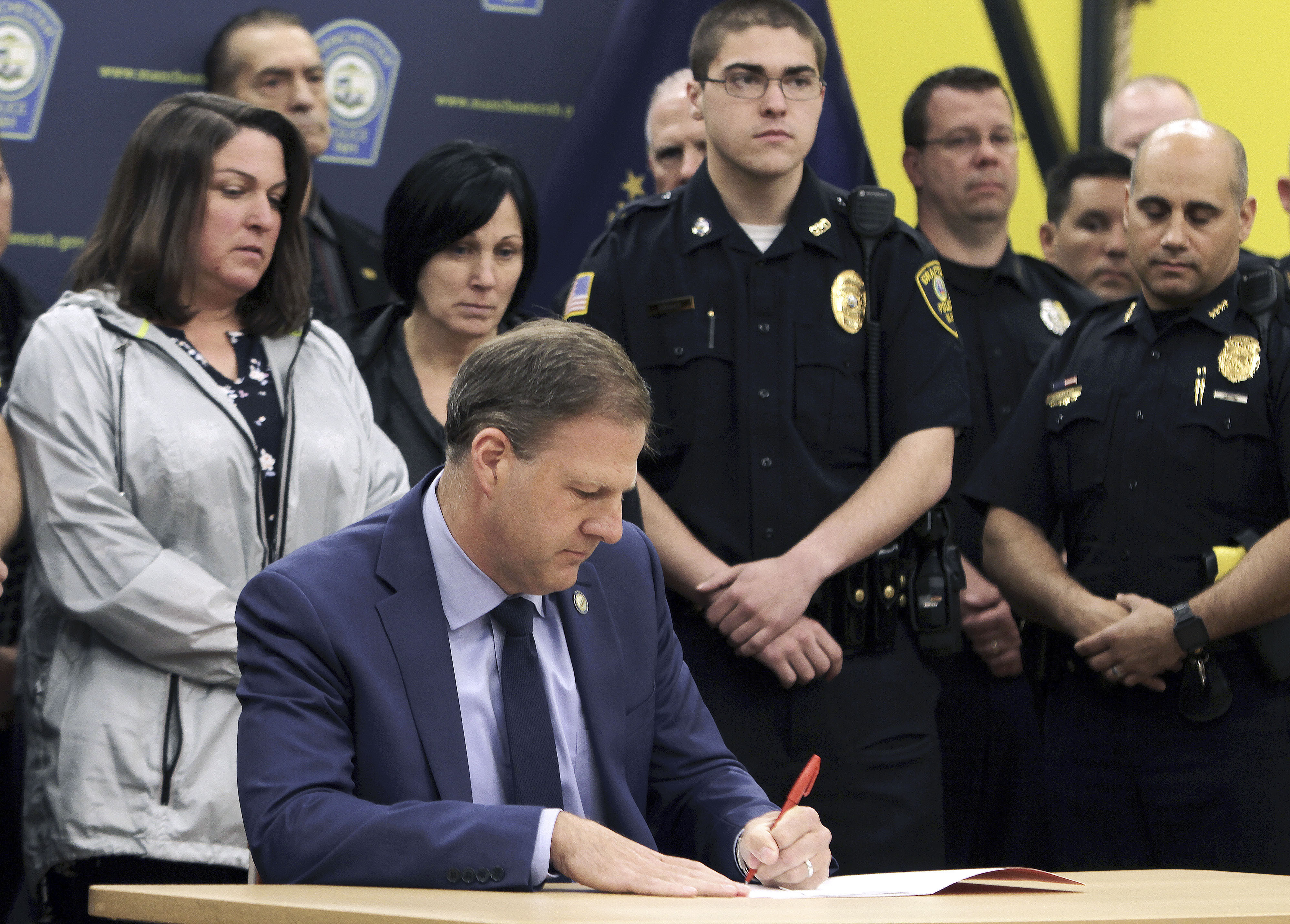 When Governor Chris Sununu vetoed the repeal bill this month, he did so from inside the Manchester Police Athletic League Officer Michael Briggs Community Center, blocks from where Officer Michael Briggs was killed, flanked by police officers and Briggs’s family.