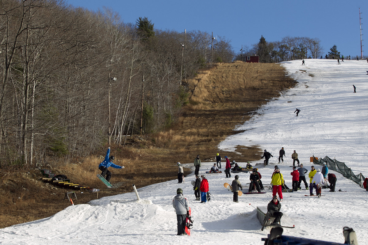 Skiers and snowboarders frolicked yesterday on manmade snow at Blue Hills Ski Area.