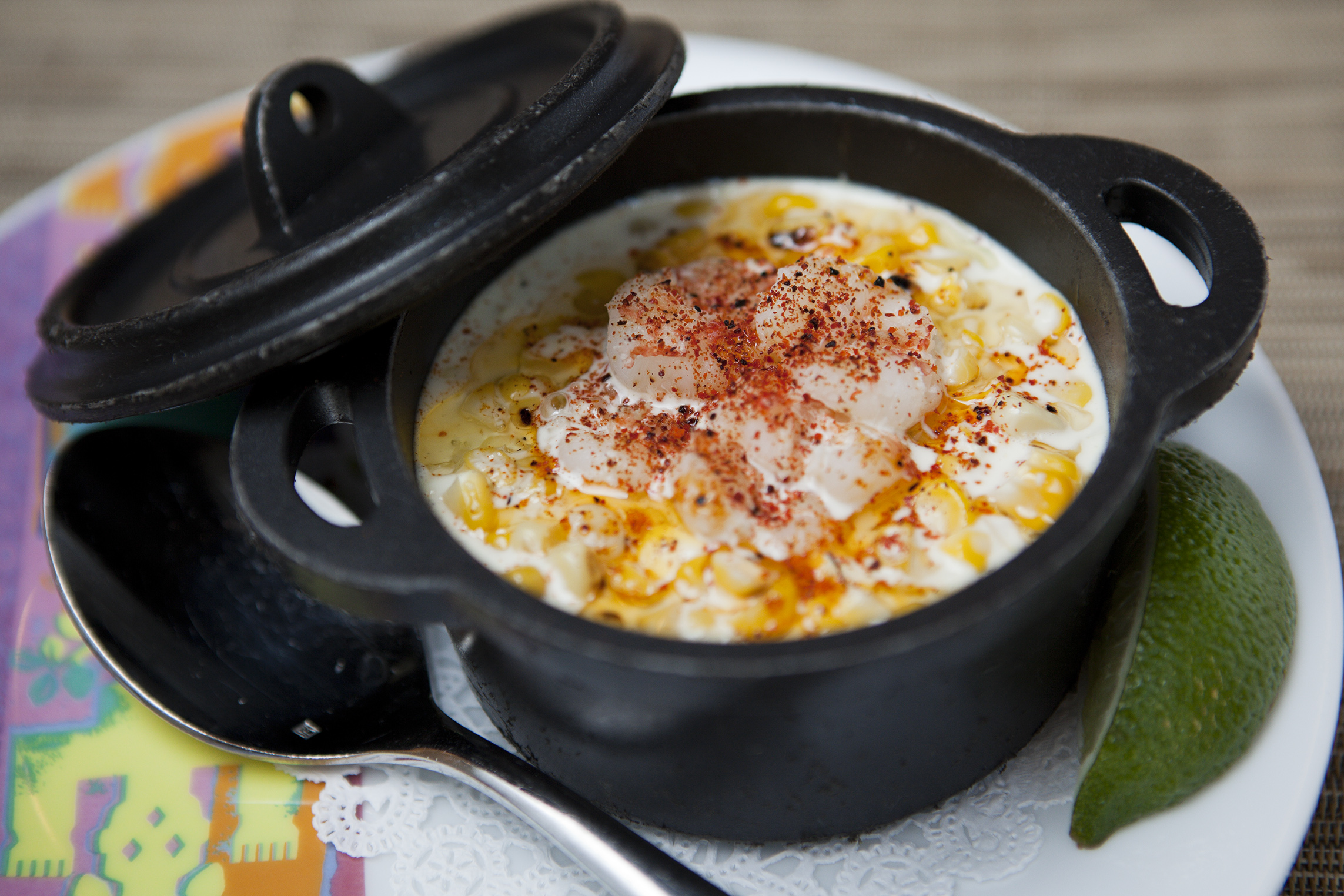 Esquites, a dish of grilled corn with ancho chile, cheese, and crema.