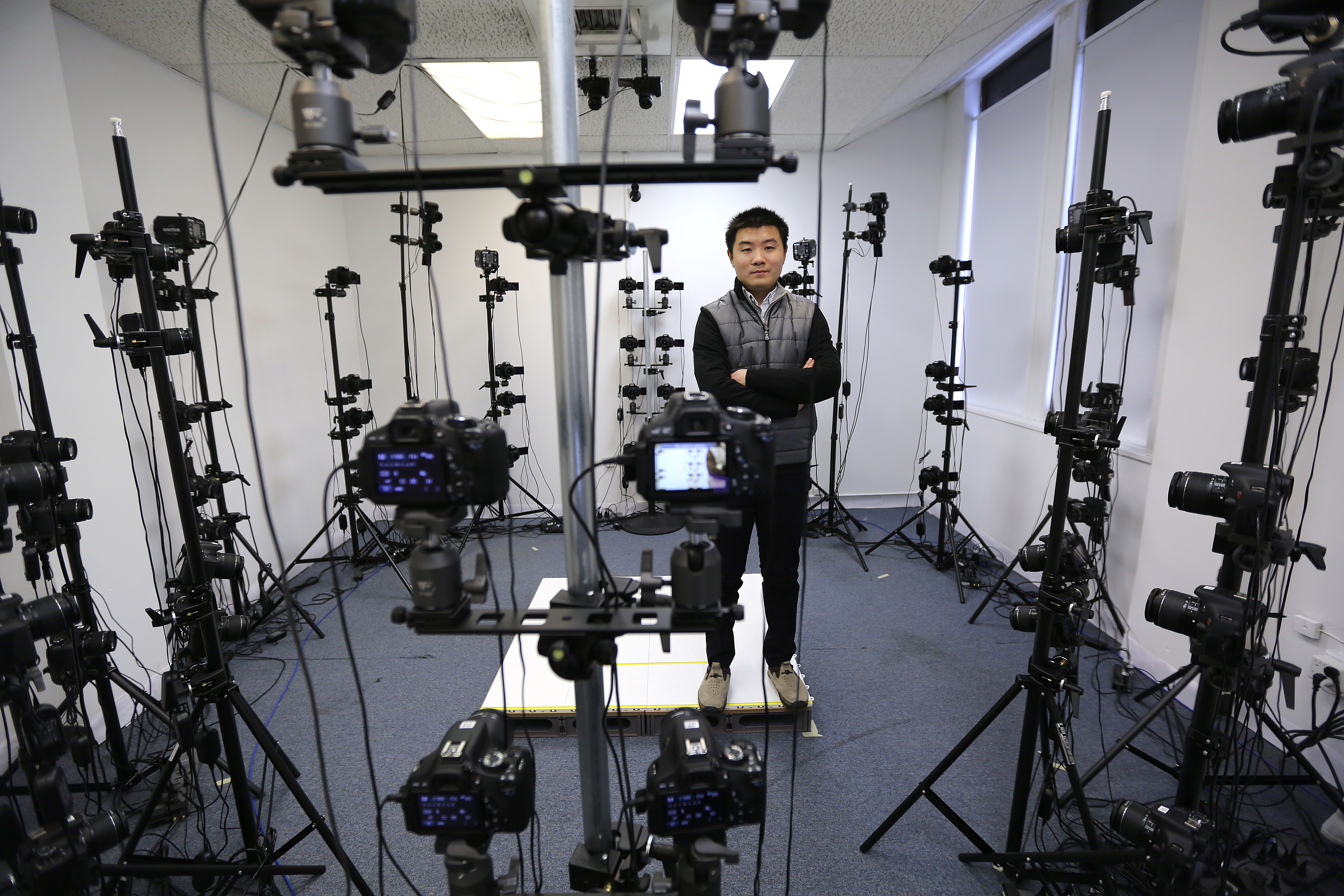 -Yifei Zhang and his former studio in Malden, where he used 70 cameras to capture 3D images of his subjects. His new studio includes 90 digital cameras.