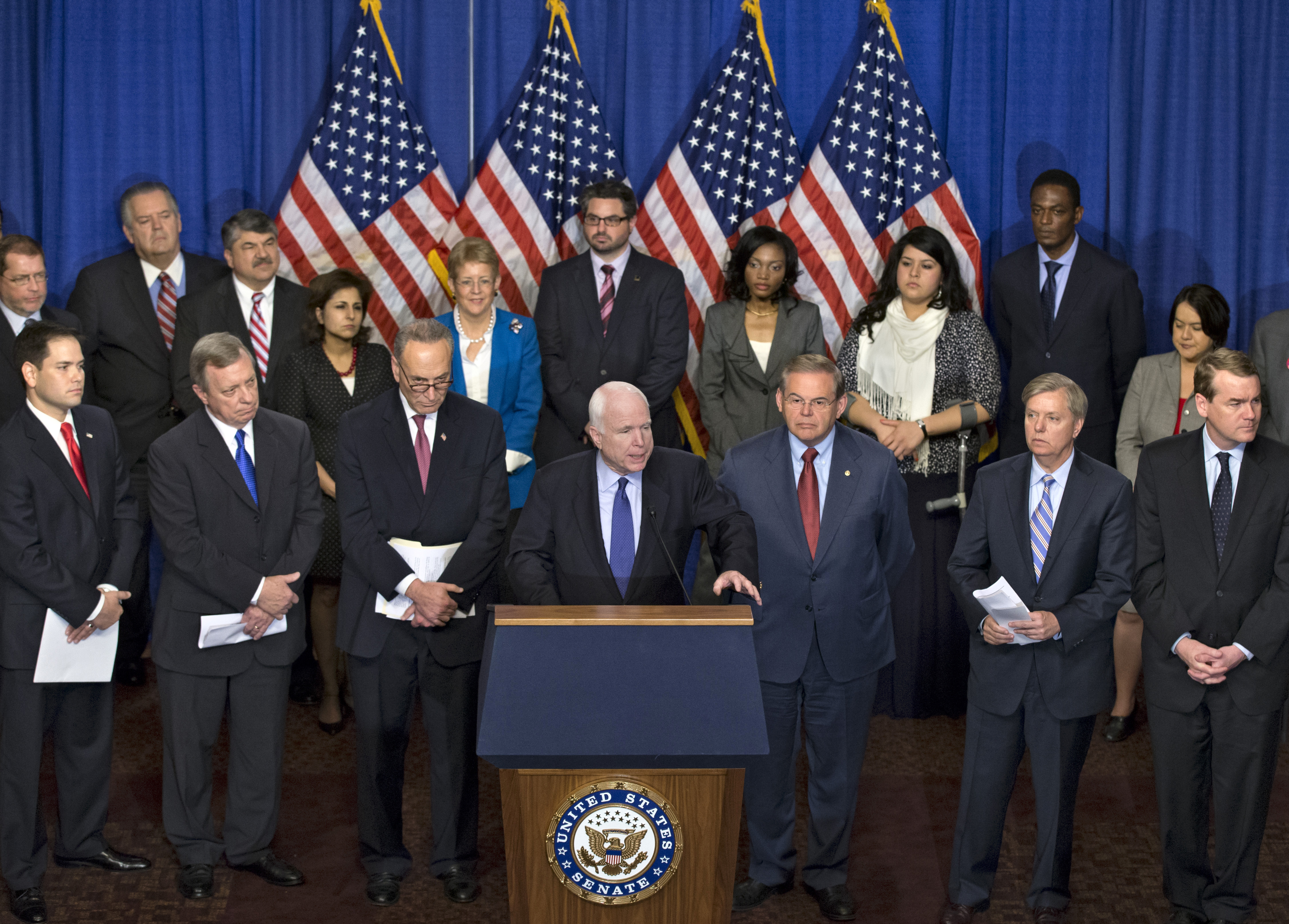 Senator Marco Rubio (left front) was among the lawmakers on hand in 2013 when Senator John McCain (center) outlined immigration reform legislation.