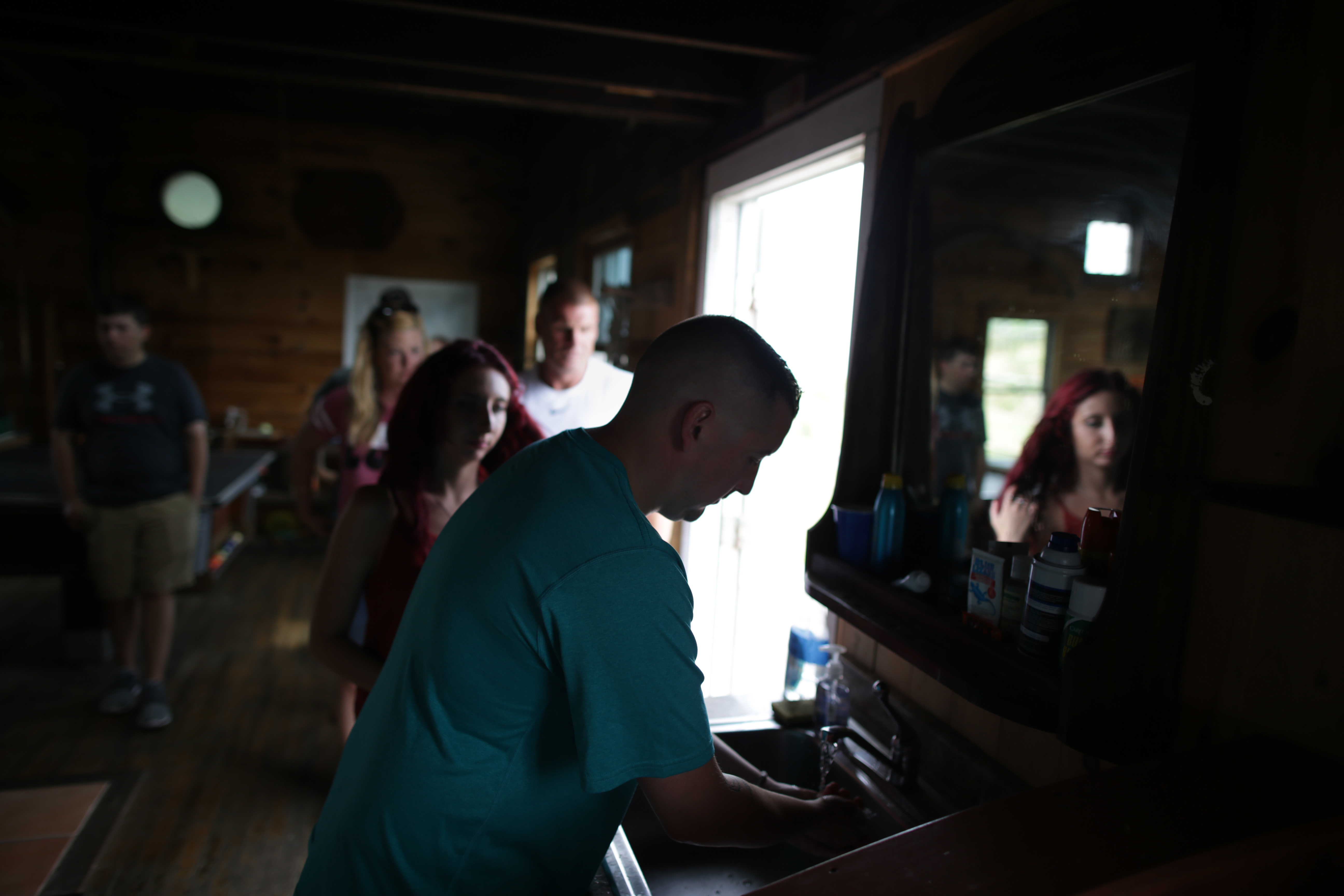 Participants in the retreat lined up to wash their hands before lunch.