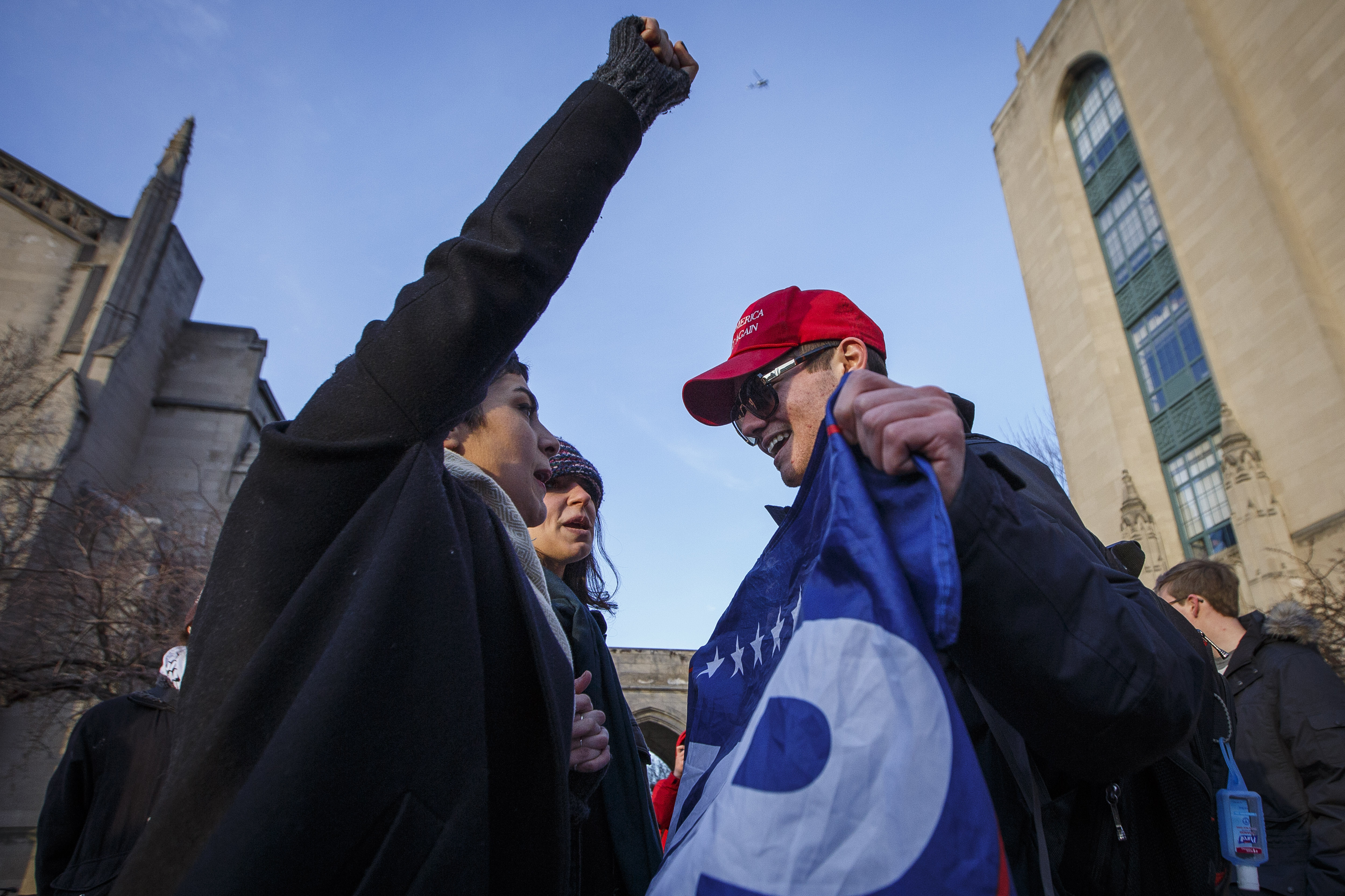 Mass Arts students Anisa Hosseinnezhad, left and Samantha Corsini, yelled at Boston University student Nick Fuentes, a supporter of President Trump on Monday.