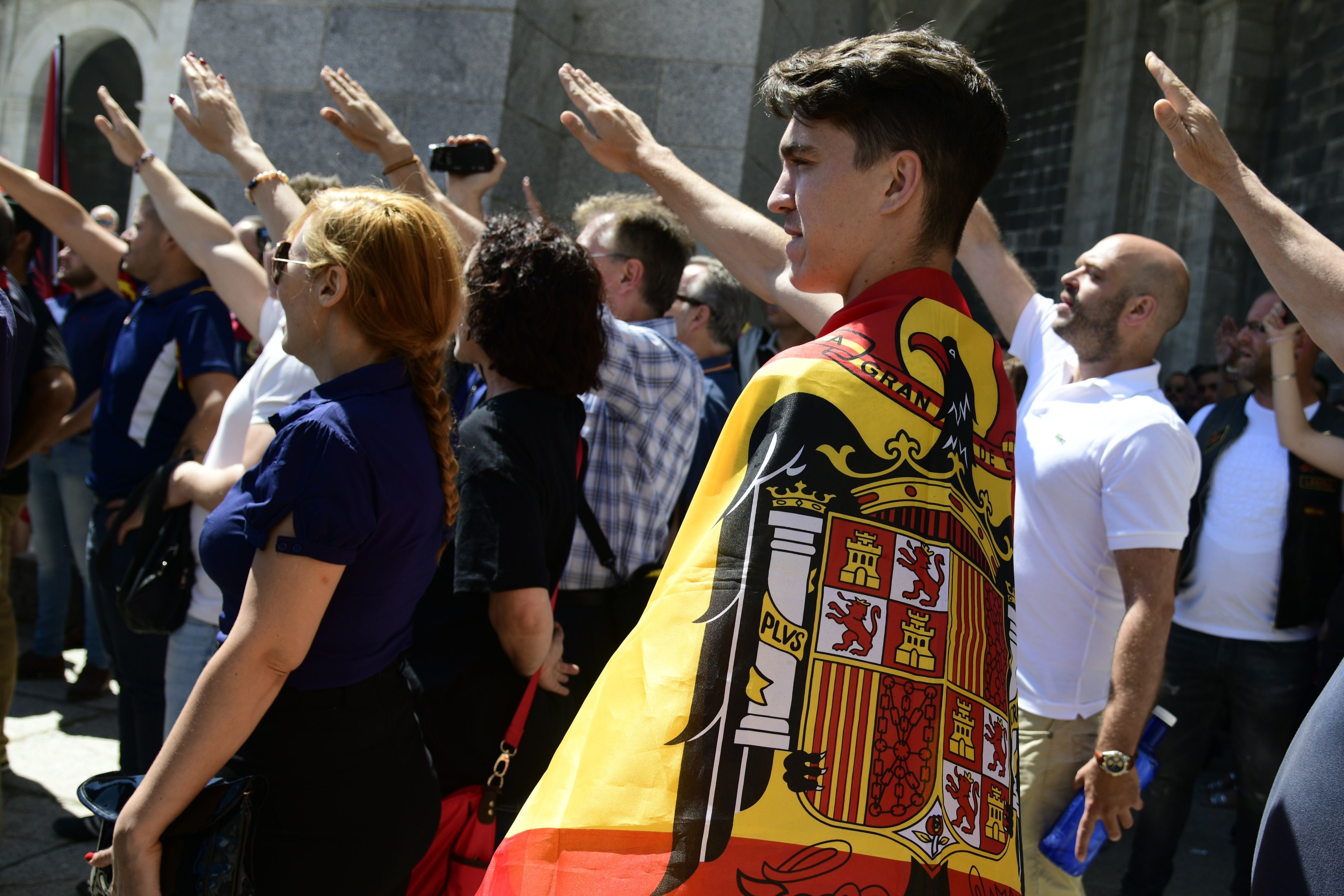 Protesters opposed to the removal of Franco’s remains raise their arms in a fascist salute at the Valley of Fallen on July 15, 2018.