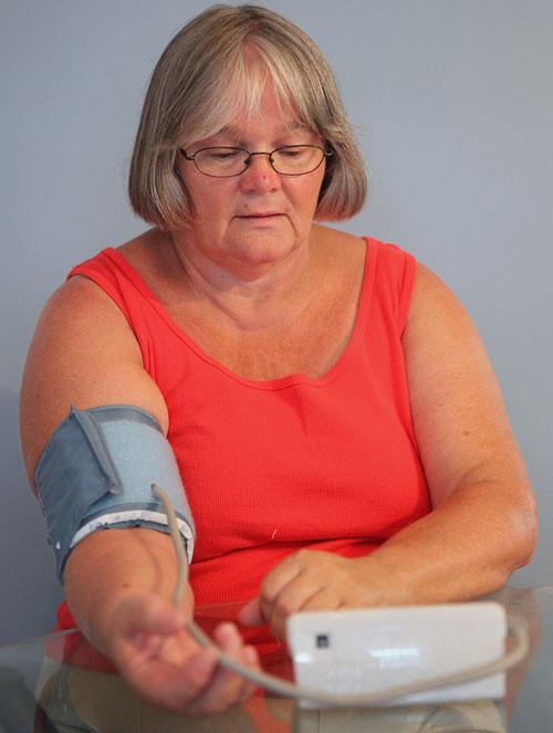 Sandra Rice, 61, takes her measurements daily to monitor chronic hypertension.