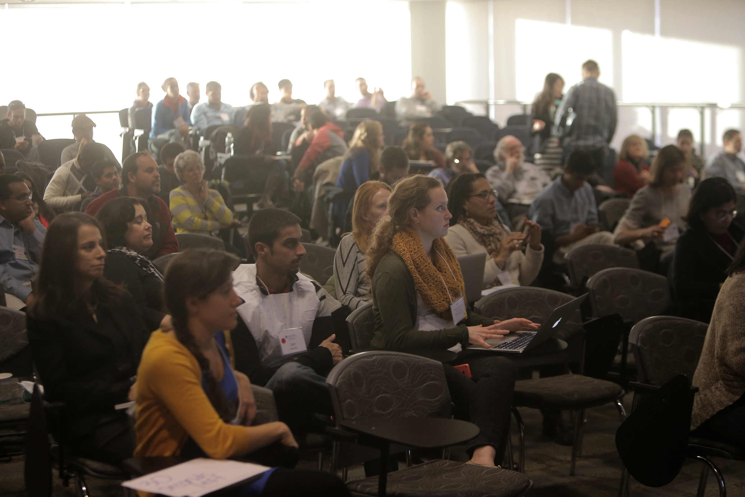 Audience members and participants at the Stop Ebola Hack-a-thon watched a presentation.