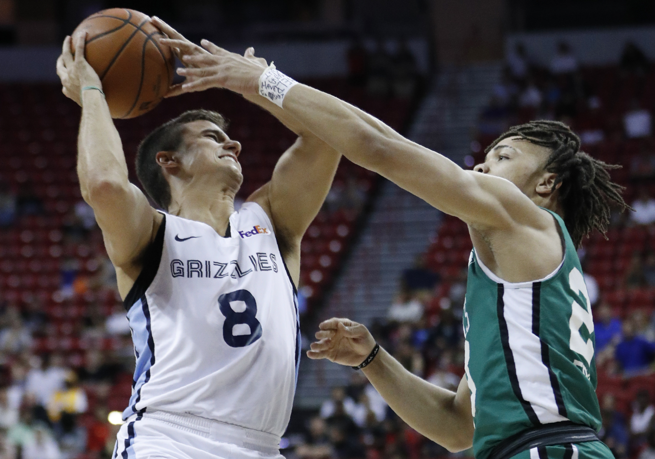 Carsen Edwards (right) kept a close watch on the Grizzlies' Dusty Hannahs during Thursday’s summer league game.