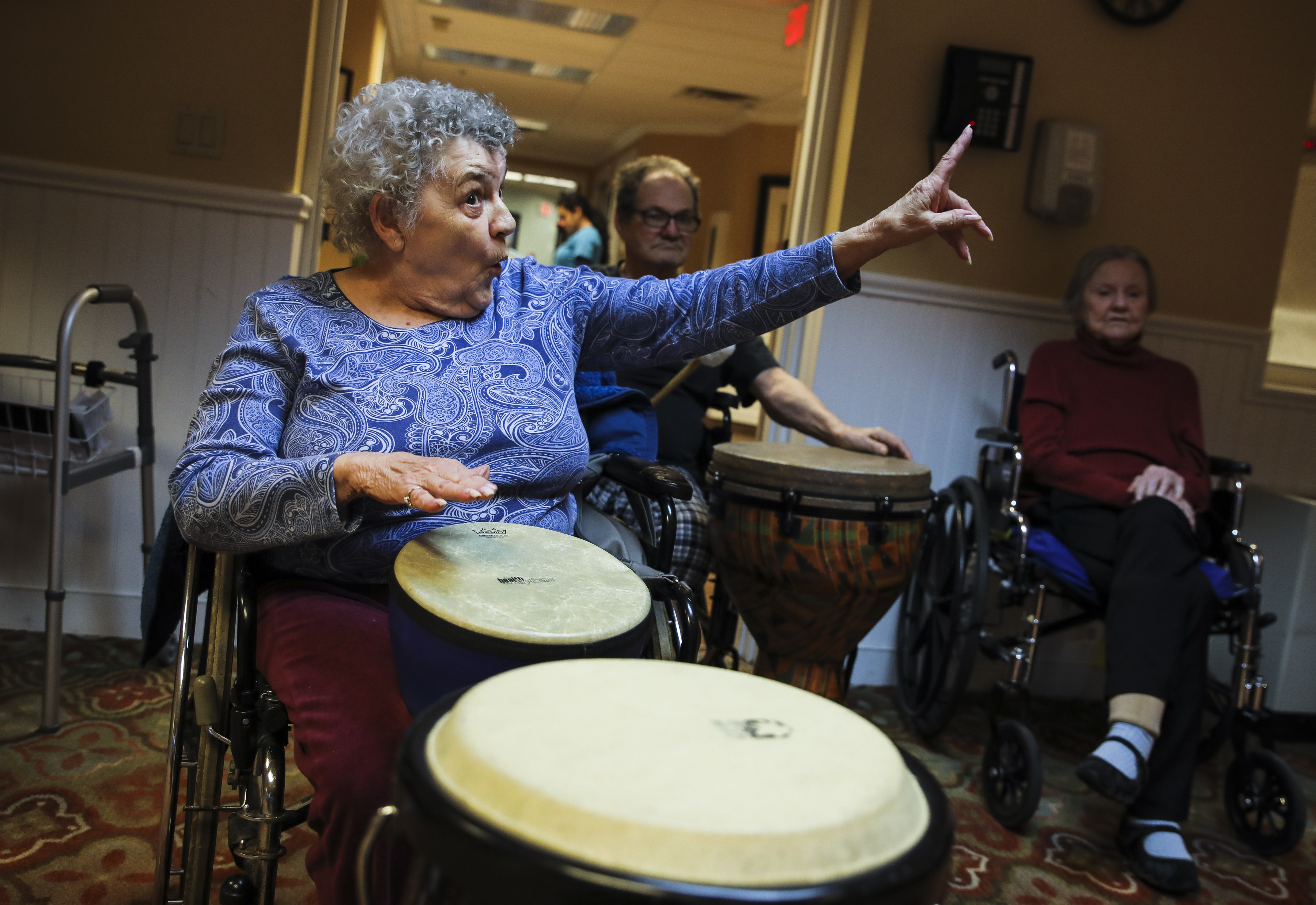 Gloria Donahue sang Christmas carols in a “drum circle” led by David Currier.