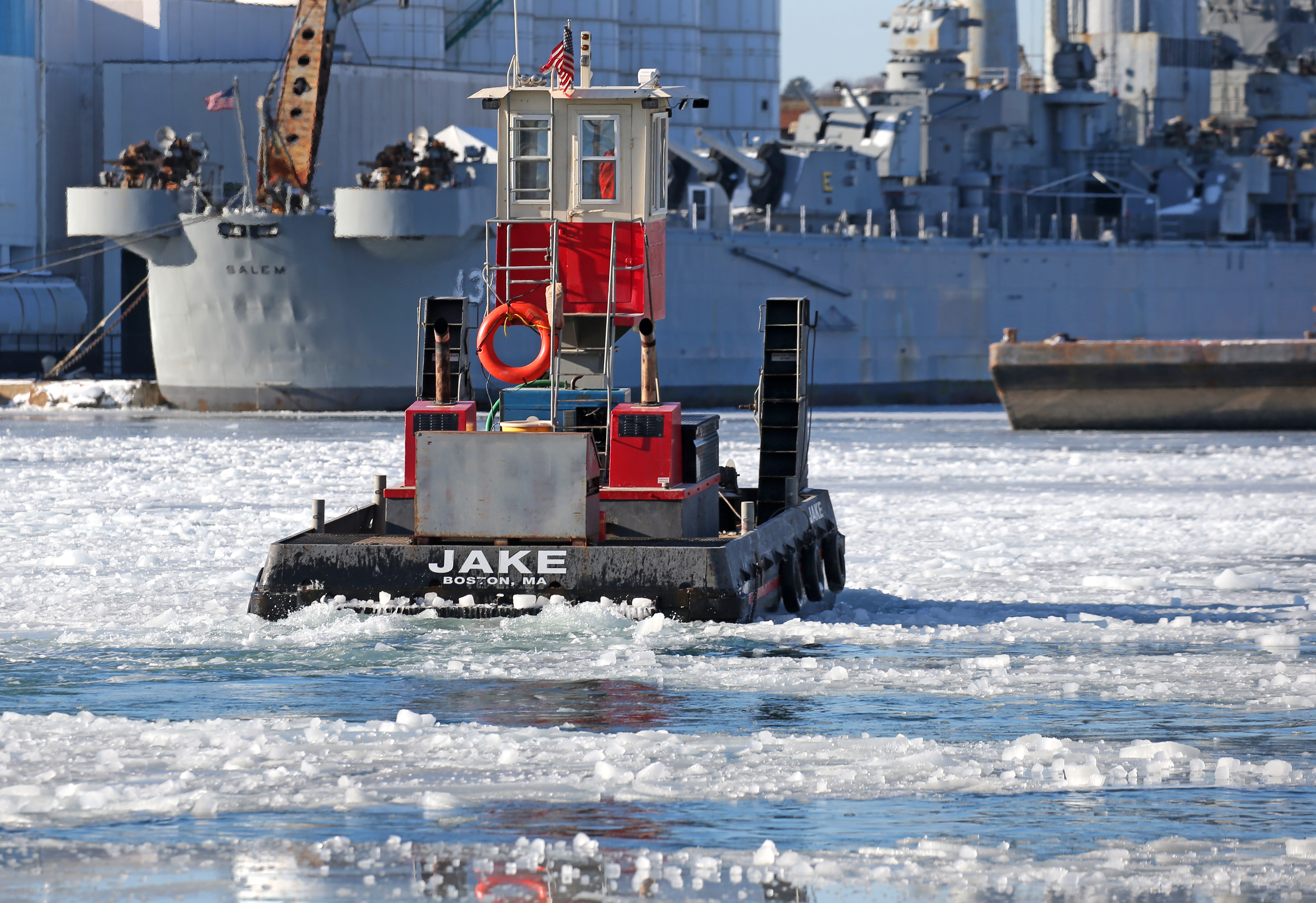 A small tug in Weymouth broke up ice in the Fore River.