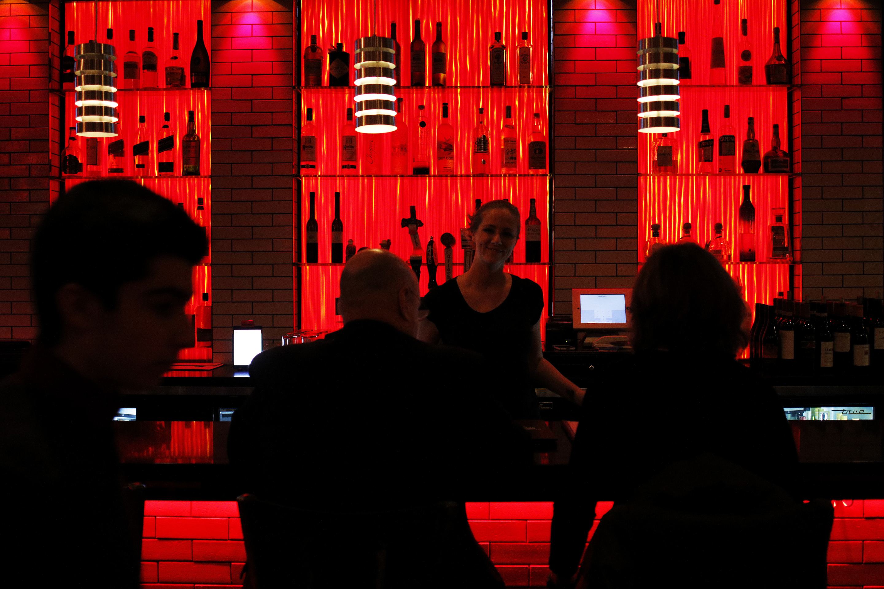 Chrystal Brown, the bar manager at Charcoal Guidos Trattoria on Moody Street in Waltham, took a customer’s order on Friday evening.