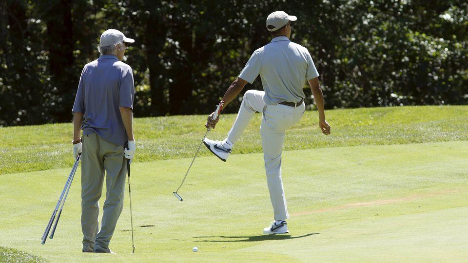 Then-President Barack Obama reacted to a missed putt at Farm Neck Golf Club in Oak Bluffs in 2015. Actor-comedian Larry David (left) played golf with Obama.