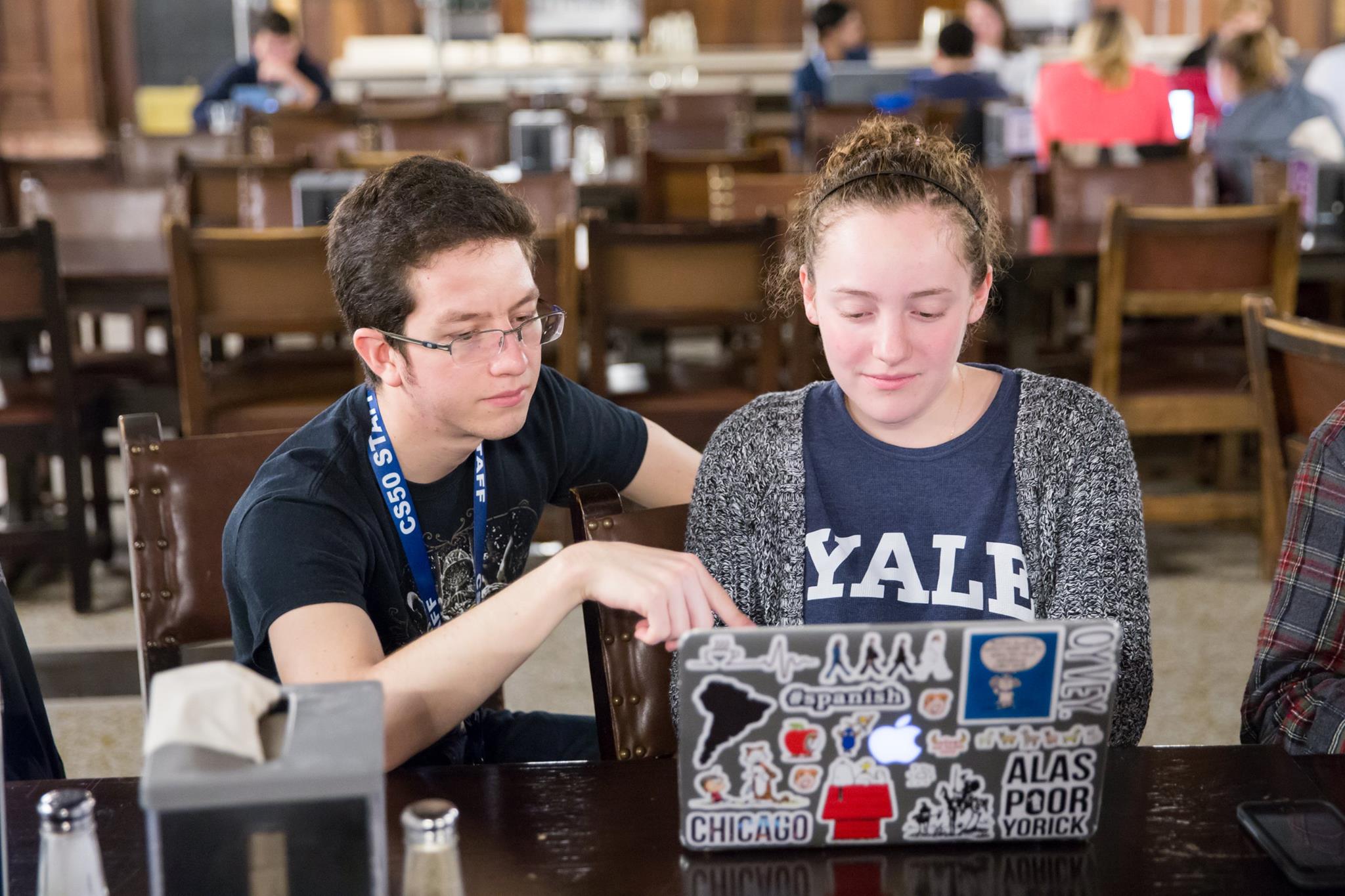Diego Torres (left) helped a student during office hours for CS50 at Yale University.