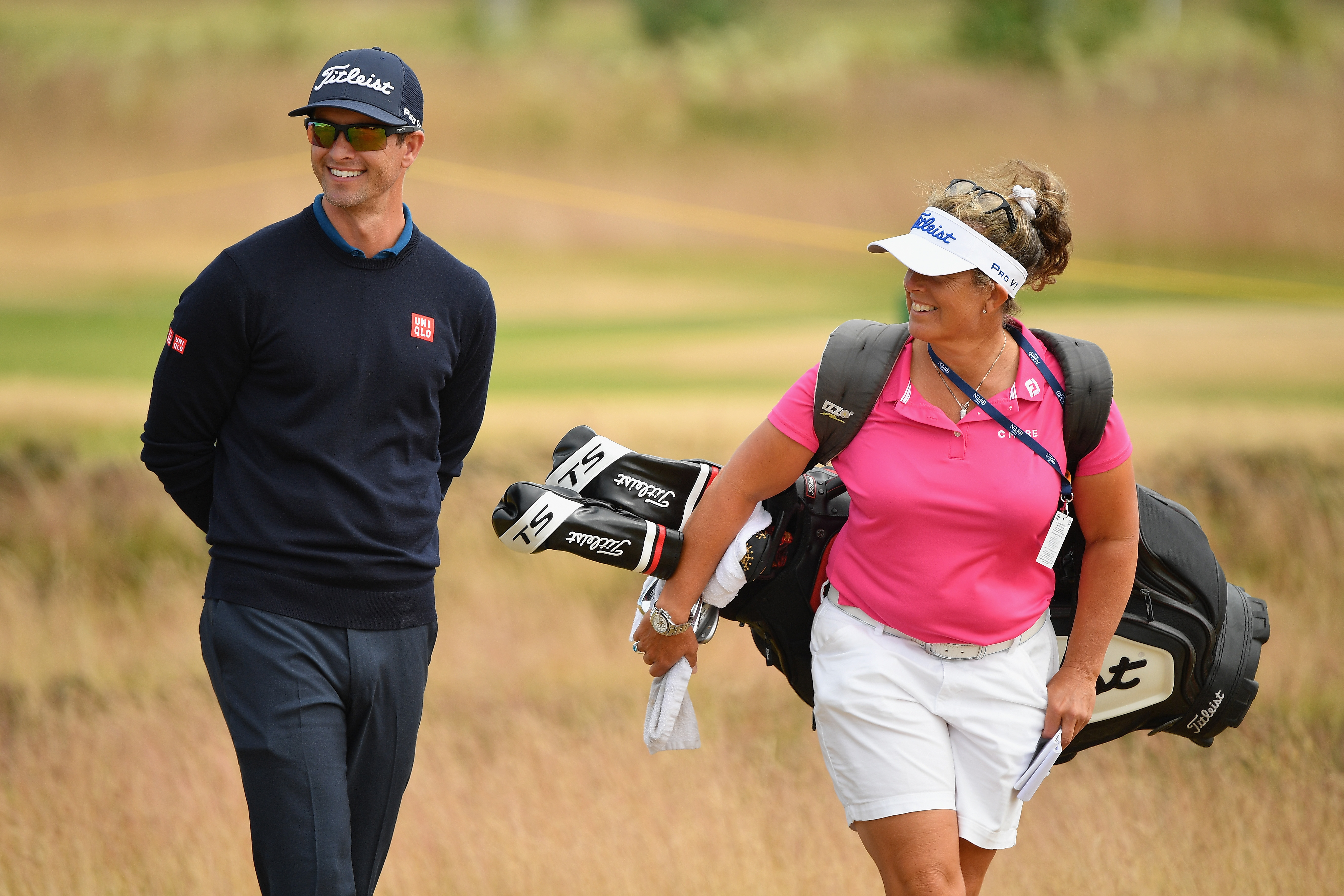 Adam Scott and his caddie Fanny Sunesson make their way through a practice round at Carnoustie Golf Club.