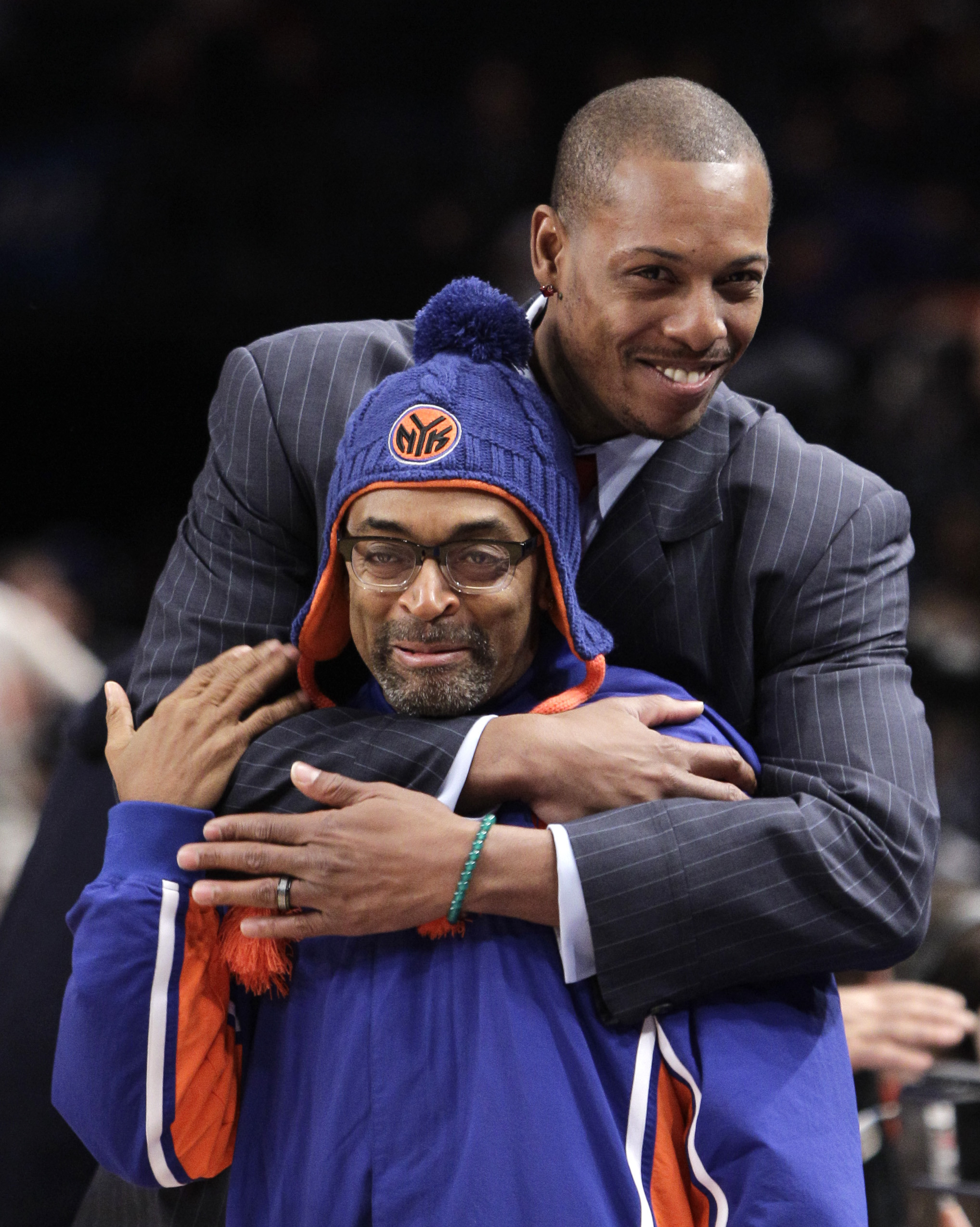Celtics forward Paul Pierce embraced director and New York Knicks fan Spike Lee before the game yesterday.