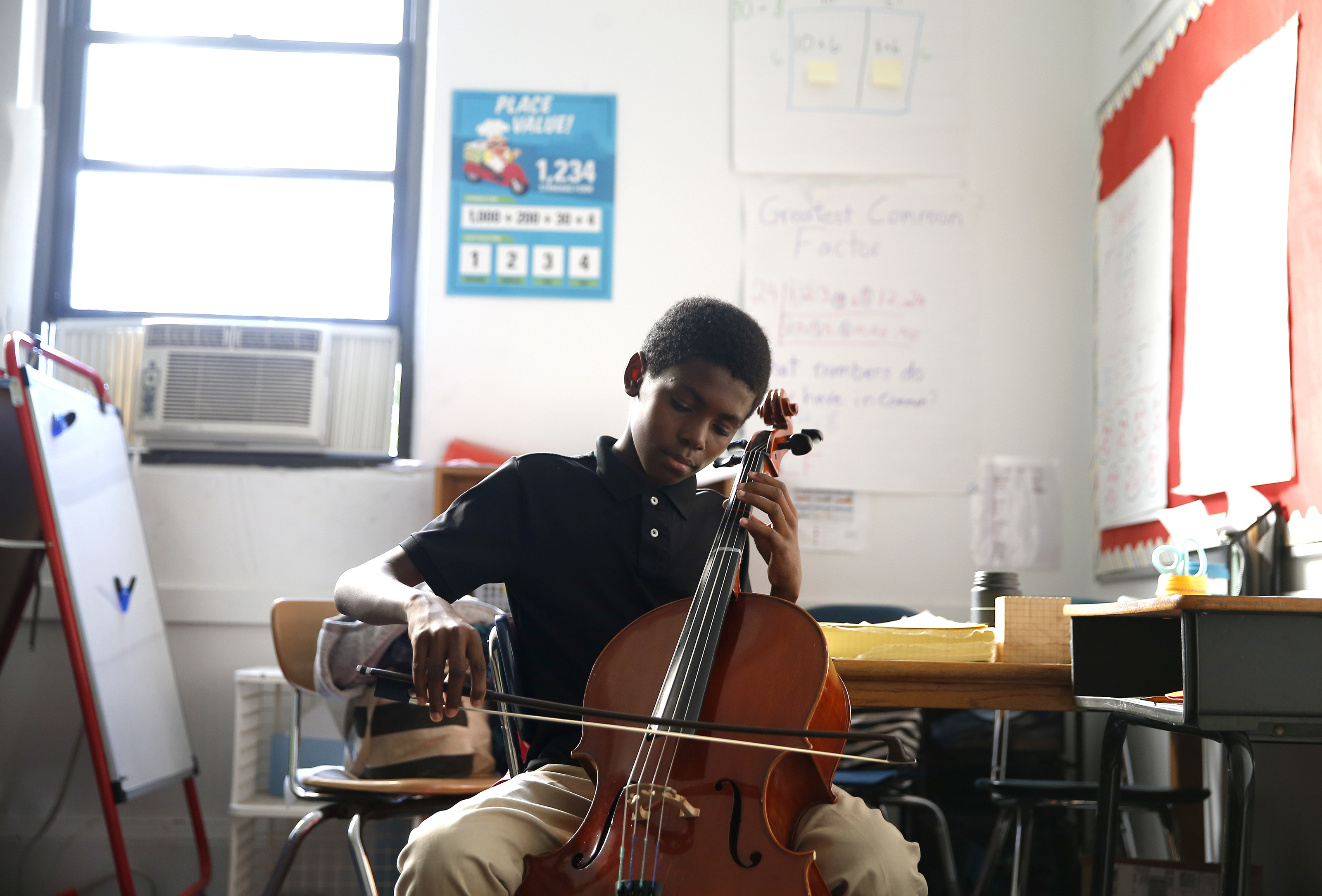 Jason Douglas practiced his music lesson inside a classroom at Bridge Boston Charter School in Dorchester.