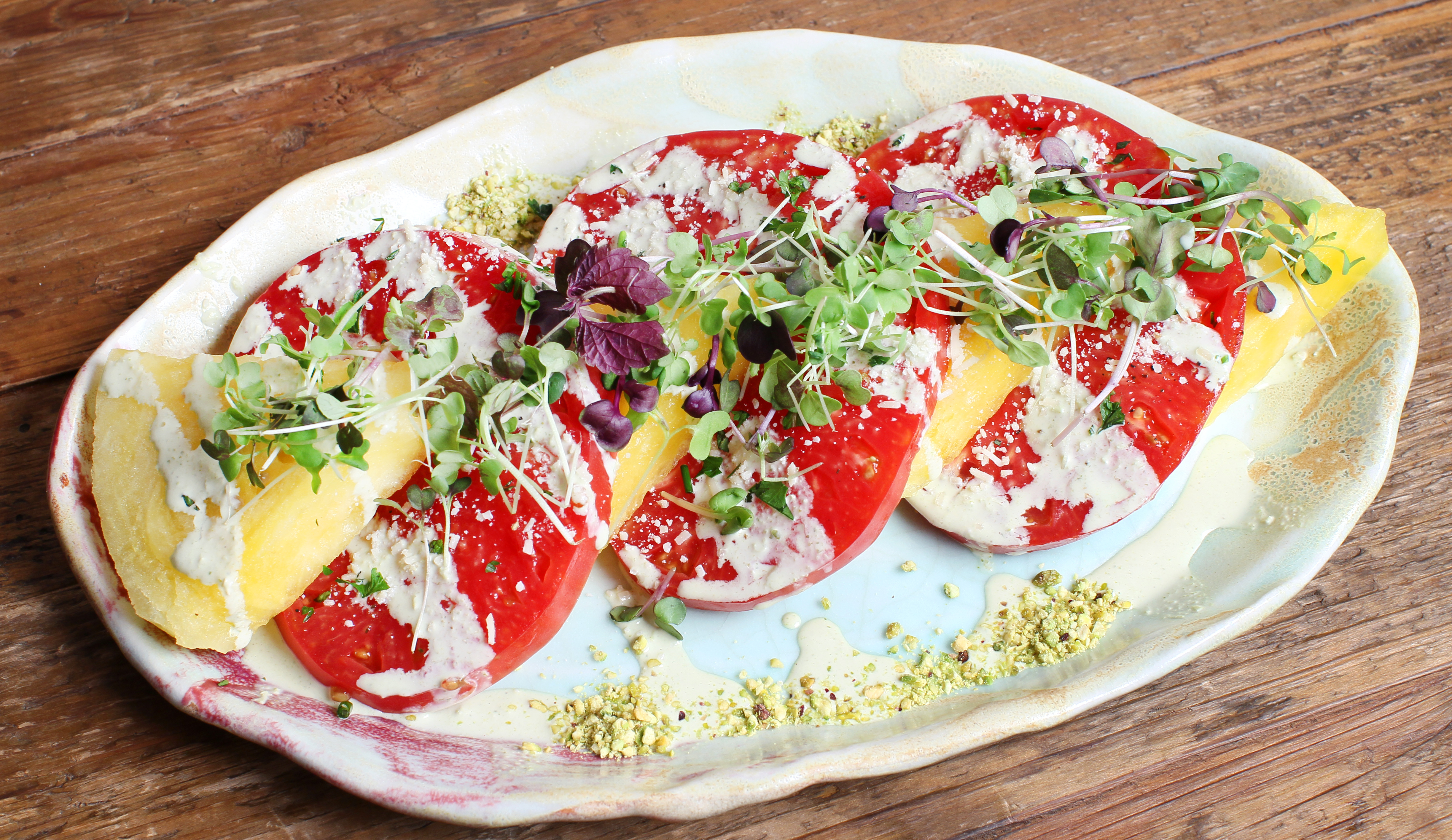 Watermelon-tomato salad with green goddess dressing and pistachios.