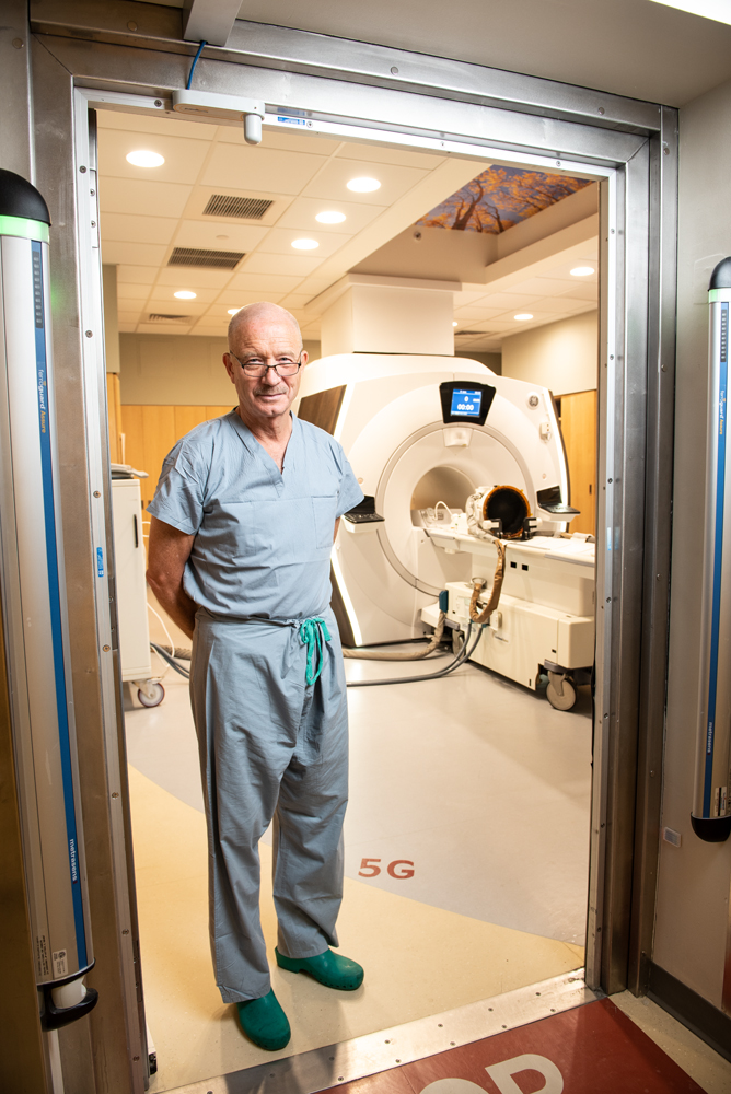 Rees Cosgrove, a neurosurgeon at Brigham and Women’s, with the MRI machine he uses to perform noninvasive brain surgery.