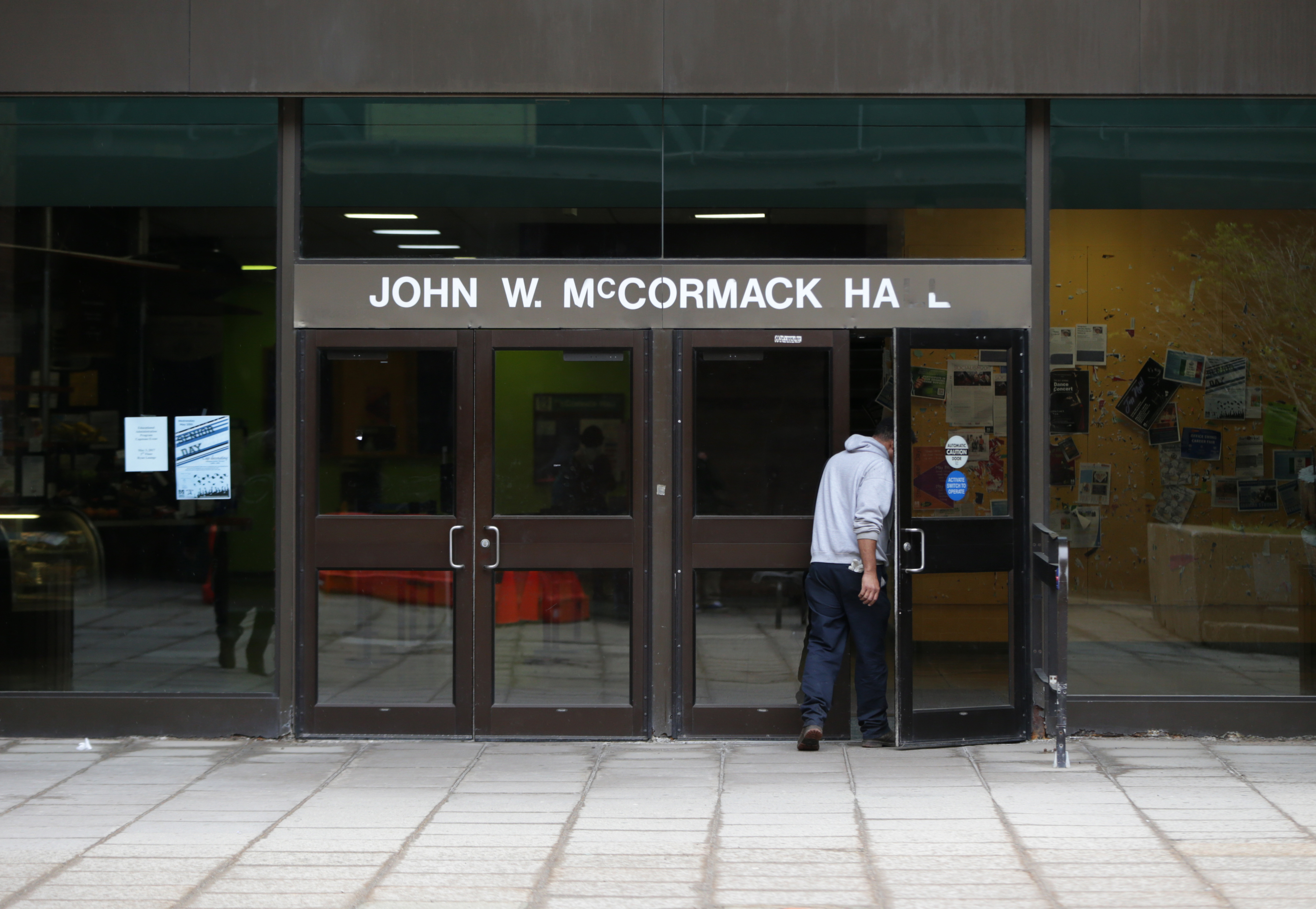A student entered McCormack Hall on the UMass Boston campus.