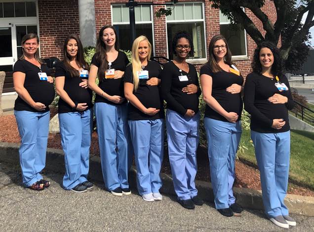 Seven of the eight co-workers at North Shore Medical Center who were expecting at the same time. Three have since had their babies.